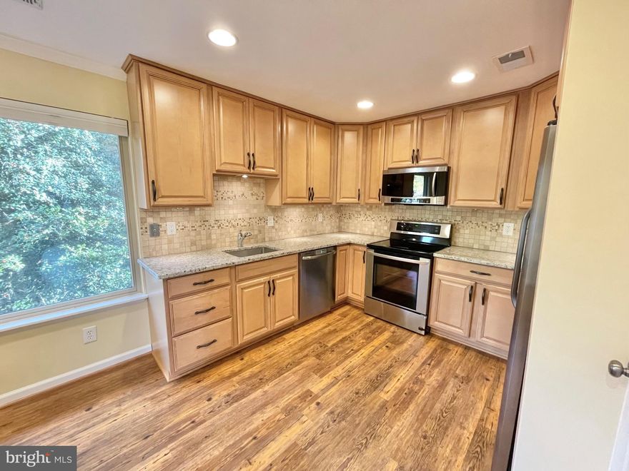 Discover convenience and comfort in this lovely end unit townhouse tucked away in a peaceful corner of the community. Updated throughout, this home offers a modern kitchen with stainless steel appliances, updated maple cabinets, and granite countertops. The main level features a bright dining room flowing into a spacious living area with abundant natural light and ample storage. A powder room completes this level for added convenience.

Upstairs, three well-sized bedrooms and two bathrooms await, including a generous owner's suite with an en-suite bathroom and large walk-in closet. Wood and tile flooring throughout ensure both elegance and easy maintenance.

Located just 0.6 miles from the McLean metro station and steps from bus stops, commuting is effortless. Nearby amenities include Safeway, Lost Dog Cafe across the street, Wegmans, Capital One Center, and Tysons Corner Malls. 

Rent covers water, sewer, trash, and parking. The community offers a pool, playground, and ample parking. Pets are considered on a case-by-case basis. Don't miss out on making this your new home - schedule a visit today and experience comfort and convenience at its finest!