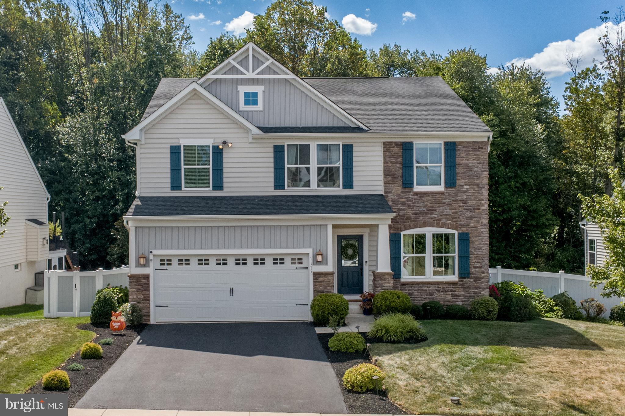 Welcome to Hidden Oaks, a premier development by Ryan Homes .
As you step inside, you're greeted by the warmth of hardwood floors and an abundance of natural light that flows throughout the main level. A versatile sitting room—ideal as an office or reading nook—and a formal dining room offer elegant spaces for both work and entertaining. The spacious living area, centered around a cozy gas fireplace, opens effortlessly into the gourmet kitchen and bright morning room. Here, panoramic views provide a serene backdrop to your everyday moments. Designed for the modern chef, the kitchen features stainless steel appliances, lustrous granite countertops, an expansive 8-foot island with seating, custom cabinetry, and chic pendant lighting—blending style and function seamlessly. The morning room leads to a large deck overlooking the fenced yard. Upstairs, the primary suite serves as a private retreat, complete with tray ceiling, dual walk-in closets, and an en-suite bath boasting a double vanity and high-end finishes. Three additional bedrooms offer generous space, each with large closets and oversized windows that flood the rooms with light. A beautifully appointed hall bath and a convenient upstairs laundry room complete this exceptional level. The lower level is designed for both relaxation and creativity, offering a rec room with patio access, a craft room,/office and plenty of storage. The attached two-car garage , with EV charger., completes this lovely home.
This is a must-see home—where comfort, luxury, and style meet in perfect harmony.
Schedule your private tour today!