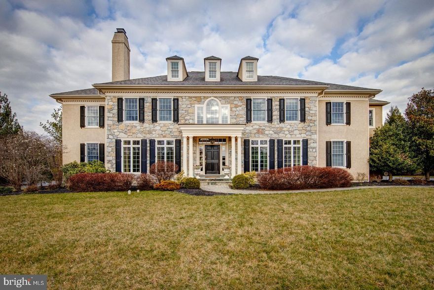 Magnificent colonial manor home built by Bentley Builders with over 5,600 square feet of exceptional living space situated on a beautiful level lot with mature landscaping on a cul de sac in the community of Whitegate. The exterior features include a beautiful grey mica stone front, two expansive EP Henry patios, firepit, outstanding stone hot tub with waterfall cascading into a fabulous pool with water features, three-car side load garage, and a beautiful backdrop of mature plantings and extensive landscaping.  The interior of this elegant home features a large living room with fireplace, formal dining room, top-of-the-line custom kitchen with every imaginable amenity, a light-filled breakfast room, a bright two-story family room with stone fireplace, a private study and an adjacent sunroom with glass French doors to the study and family room. This open floorplan allows for active family living and great entertainment space. The Second Floor features an impressive Master Suite with dressing/sitting room, custom walk-in his and her closets, sumptuous master bathroom with oversized whirlpool soaking tub and large glass enclosed shower and four additional ensuite bedrooms with walk-in custom closets. Hardwood floors throughout the first floor, 10  ceilings, high hat lighting throughout and numerous picture windows make this home airy and bright. This central location is just minutes from King of Prussia and Wayne for local shopping and dining and is within close proximity to all major roadways for commuting to Center City, the airport and the 422 and 202 corporate corridors.