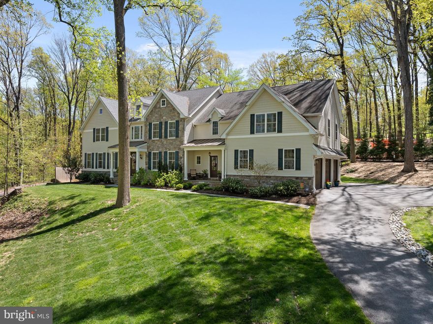 Crafted by the esteemed Renehan Building Group just five years ago, this residence in the prestigious Tredyffrin-Easttown School District embodies the epitome of quality construction, a highly desirable floor plan and luxury finishes.  As you step inside, a two-story foyer adorned with hardwood flooring sets the tone. To the right, an expansive dining room awaits, enhanced with crown molding, wainscoting, and a convenient wine bar. Through French doors to the left, a home office space beckons, complete with built-in shelving and abundant natural light. The heart of this home lies in the open-plan kitchen, breakfast area, and family room. The kitchen, a haven for culinary enthusiasts, showcases quartz countertops, white cabinetry, stainless steel appliances, and a center island.  Connecting the kitchen and family room, the breakfast room, with its lovely views of the rear grounds, provides a comfortable space for meals.  The family room space is elevated by a tray ceiling, a gas fireplace, and sliding glass doors that open onto the rear patio, adding to its appeal.  Nearby, a second powder room, walk-in pantry, and mudroom, lead to the three-car garage. Ascend to the second floor to discover the expansive primary bedroom suite, boasting a sitting area, luxurious ensuite bathroom, and spacious walk-in closet.  Four additional generously proportioned bedrooms, two sharing a Jack-and-Jill bathroom and two with ensuite baths, are ideal for family members and guests. The second floor also houses a convenient laundry room. The lower level is beautifully  finished, offering versatile space for entertainment and recreation, including a den, home theater room, and full bathroom.  Outside, relish the tranquility of a private wooded lot from the stone terrace, perfect for al fresco gatherings or serene relaxation. 
Enjoy music using the in-home entertainment system while relaxing on the main floor area and on the terrace.  Positioned conveniently near Rt. 202, downtown Wayne, and the bustling Main Line community, this extraordinary residence presents an optimal balance of tranquility and accessibility to amenities.