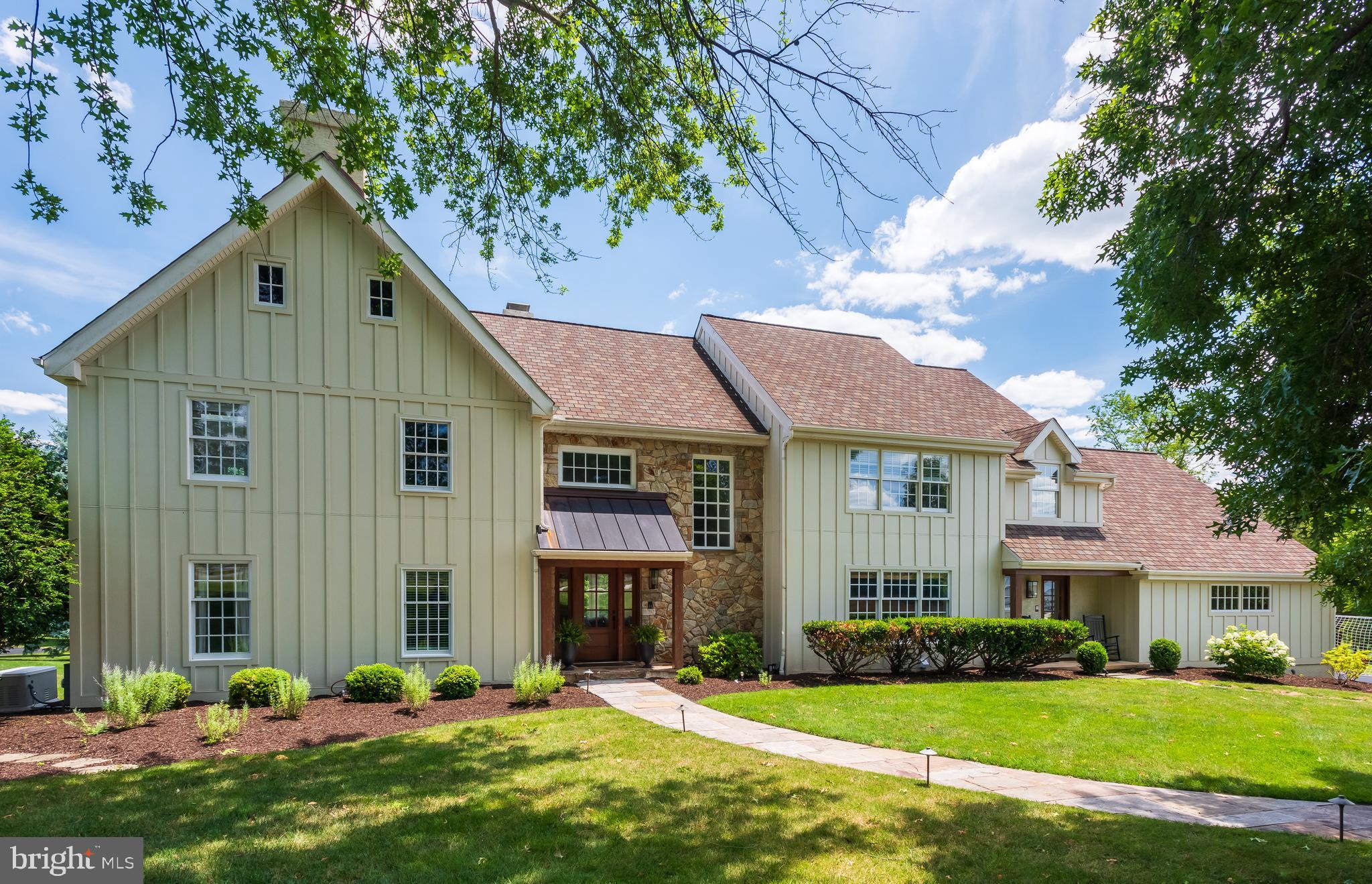 Welcome to 1879 Covered Bridge Road, a spectacular, sun drenched home offering an open concept floor plan spread across three gorgeously finished living levels, set on a fabulous lot in the top ranked Tredyffrin-Easttown School District. This is a very, very special home both inside and out. Enjoy gorgeous views out every window and doorway. A rare opportunity to step right into a picture perfect home in a prime location with a gorgeous FIRST FLOOR in-law suite. The stately two story entrance hallway with curved staircase leads to the fabulous family room featuring a vaulted ceiling, twin skylights, sliding glass doors to the deck, a terrific picture window and a two sided fireplace with dramatic floor to ceiling custom stone work. The classic living room offers an exposed ceiling beam and a gas fireplace with gorgeous marble surround. The heart of the home is the spacious eat-in kitchen offering plenty of raised panel cabinetry, Corian countertops, a granite topped center island, stainless steel appliances, a huge dining area and sliding glass doors to the deck. A butler's pantry with display cabinetry and serving counters connects the kitchen to the formal dining room which features wainscoting and crown molding. One of the many wonderful features of this home is the first floor in-law/au pair suite complete with a full private bathroom and direct access to a private side porch. A tiled mudroom connects the main area of the home to an oversized three car garage. A pleasant laundry room with cabinets, an additional full refrigerator, a laundry shoot from the second level hall bathroom and laundry sink plus a powder room complete the picture for the first floor of this lovely home. A large second floor hallway overlooks both the entrance hall and family room and leads to the sumptuous owner's suite with tray ceiling, a walk-in and two double closets, a separate sitting area/home office and a spacious owner's bath with double vanity, seamless glass doored shower, a jetted soaking tub and skylight. Three additional bedrooms are serviced by a spacious hall bathroom with twin vanities. A huge bonus room offers endless possibilities as an upstairs family room, home office, sixth bedroom, play area, etc. The beautifully finished lower level is a flexible space offering full size windows, a full bath, a gas fireplace, a wet bar and unfinished storage areas. The grounds of the home are truly spectacular. The deep yard offers mature plantings, shade trees and a fenced gardening area with a storage shed. The two level deck is the ideal spot for relaxing, entertaining, grilling and dining al fresco. A gorgeous front door surrounded by stone, an additional front entrance, a whole house gas generator, invisible fencing for pets, hardwood floors, recessed lighting, TREMENDOUS closet and storage space, handsome moldings and custom shelving, a rear staircase and much more all come together to make 1879 Covered Bridge a wonderful place to call home. This is a rare opportunity to own a tastefully upgraded home in a spectacular setting within the top ranked Tredyffrin-Easttown School District. Located less than 60 seconds from Valley Forge National Park and close to the shops, trains and restaurants of the Main Line and King Of Prussia. A great home on a great lot in a great location. This is the one. Welcome home!
