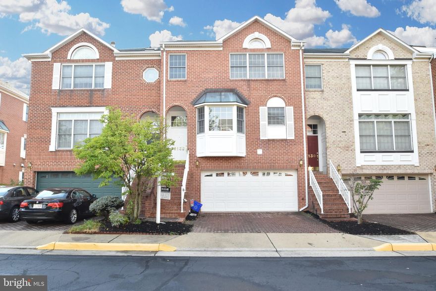 Spectacular townhouse in Colonies of Madrillon located in Tysons within walking distance of Metro, shopping and restaurants. Brazilian Koa floors on main level, spiral staircase, gourmet kitchen with center island, granite, upgraded SS appliances and eat in area. Master has vaulted ceilings. Finished basement. Large deck backing to trees. Patio opens to fenced yard. 2 car garage. Ready to move in.