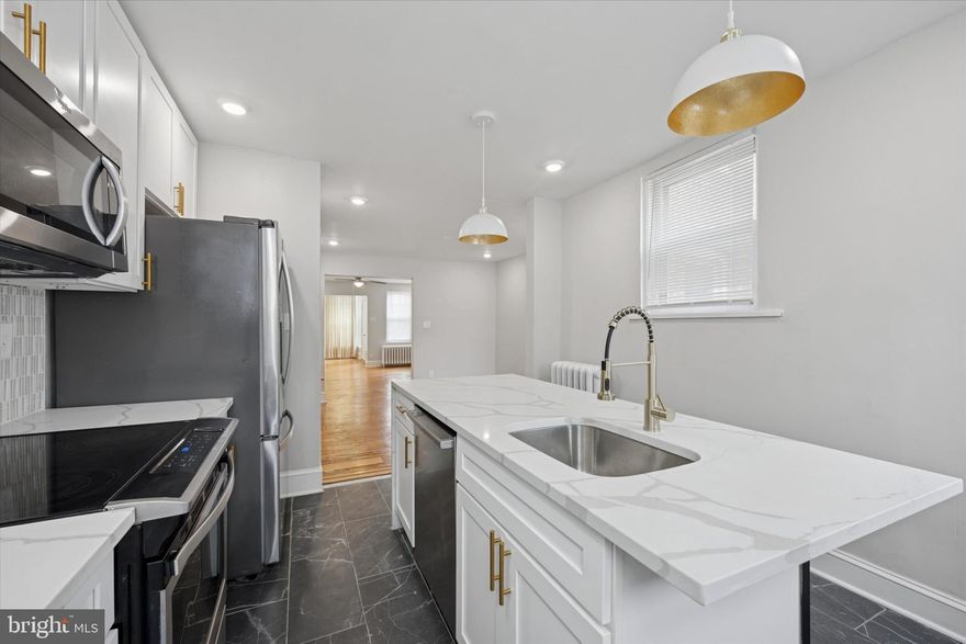 Welcome to 2112 N 57th Street, Philadelphia, PA 19131. Located on a quiet block in the desirable Wynnefield section, this beautiful home opens into a spacious living room and dining area—perfect for entertaining or relaxing. The renovated kitchen features a center island and brand-new stainless steel appliances, including a refrigerator, dishwasher, microwave, and stove. With 3 generous bedrooms, 2 full bathrooms, and 1 convenient half bath, the home offers comfort and functionality throughout. The finished basement provides direct access to your driveway, while the enclosed front porch adds a cozy space for morning coffee or evening unwinding. Situated within walking distance to St. Joseph’s University and City Avenue, and close to public transportation including bus routes and regional rail lines, this property offers easy access to Center City and surrounding neighborhoods. Whether you're a first-time buyer or an investor seeking a prime opportunity, this home combines location, space, and potential. Don’t miss your chance to own a piece of Wynnefield