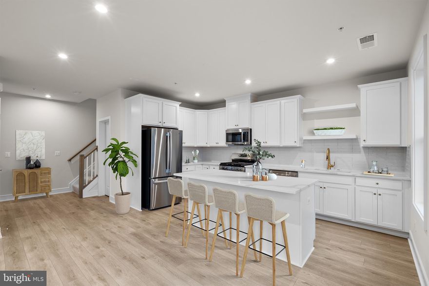 Discover a NEW TOWNHOME-STYLE CONDOMINIUM by Van Metre Homes in BROADLANDS is available for you to call home IMMEDIATELY. Nestled within the Broadlands community, this prestigious Collier 24-R1-RT floorplan spans 2,032 finished square feet across 5 levels. Experience the Collier 24-R1-RT – Homesite 183 at Demott & Silver—a one-car, rear-load garage condominium with three bedrooms, two full bathrooms, and two half bathrooms. Designed for elevated, low-maintenance living, this floorplan blends townhome-style comfort with everyday convenience. Offering an entertaining rec room, a primary suite with dual walk-in closets, a spacious rooftop terrace and deck on the second level, making everyday moments feel effortless. Step inside and be greeted by an impeccably designed living space boasting 9' ceilings and sprawling luxury vinyl plank flooring. The kitchen boasts upgraded cabinets, quartz countertops, stainless-steel appliances, and a central island. The impressive primary suite has dual walk-in closets and a lavish 4-piece bathroom replete with double sinks and an oversized, frameless shower enclosure featuring a built-in seat. Venture to the top level, where two additional bedrooms await alongside a well-appointed full bathroom. Meanwhile, the lower level offers a spacious, multipurpose rec room, a convenient half bathroom, and internal access to the private garage. But that is not all! Embrace the allure of urban living with a touch of luxury as you entertain guests or savor tranquil moments on the breathtaking rooftop terrace, where panoramic vistas await. Being a new build, your home is constructed to the highest energy efficiency standards, comes with a post-settlement warranty, and has never been lived in before! Take advantage of closing cost assistance by choosing Intercoastal Mortgage and Walker Title. Schedule your appointment today! ----- Discover Demott & Silver, Van Metre’s exceptional community of townhomes and townhome-style condominiums nestled within the master-planned Broadlands community. This sought-after neighborhood offers unparalleled convenience with walking distance access to Metro’s Silver Line and the area’s most desirable amenities. Residents relish in a host of top-notch amenities across Broadlands, including a clubhouse, fitness center, three pools, tennis courts, vast green spaces, and extensive hiking and biking trails. With shopping, restaurants, Metro’s Ashburn Station, a bus stop, and nearby commuter routes at your fingertips, Demott & Silver is set to become the epitome of a superior community in Broadlands. ----- *Other homes sites and delivery dates may be available. Pricing, offers, and availability are subject to change without notice. Images, renderings, and site plans are for illustrative purposes only and may not reflect actual homes or features. Some images and renderings may depict interior designs created in collaboration with AI or may represent a similar home. Additional terms and conditions may apply. Please see a Van Metre Sales Advisor for details.