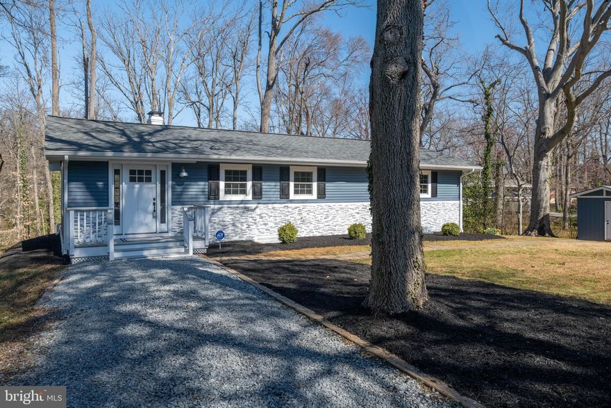 ***Motivated Seller! Schedule your showings today*** Don’t miss this completely renovated home with wooded and water views in West Annapolis! This one-of-a-kind, custom designed home is located just five minutes from Historic Annapolis! The brand-new gourmet kitchen features an open floor plan, brand-new stainless-steel appliances, white shaker soft close cabinets and exotic quartz countertops. The large kitchen island opens to the living room - making it perfect for entertaining. 

The two full bathrooms have been completely remodeled to include, upscale vanities, luxurious tile, a glass shower door and stylish fixtures. 

Renovations include: newer roof (2022), all new windows (including a basement egress window), interior doors, trim, drywall, waterproof laminate flooring, tile flooring, bath/kitchen renovations, custom lighting throughout, new exterior doors including – two new slider doors, gutters, front stone work, electric fireplace, built in bookshelves, decorative shiplap, HVAC unit and ductwork, water filtration system (2022), water heater, sump pump, french drain, carbon fiber straps (with a 10 year warranty) and two new driveways, and so much more! 

Entertain family and guests on the large backyard patio overlooking the Cove of Cork. Well-manicured and freshly mulched landscape beds can be found around the property. The property also has a large shed and a secondary driveway to conveniently park a boat or RV. 

The property backs to a path leading down to the Cove of Cork Marina off the Severn River. Don’t miss this beautiful home just minutes from Historic Annapolis! Schedule your showing today!