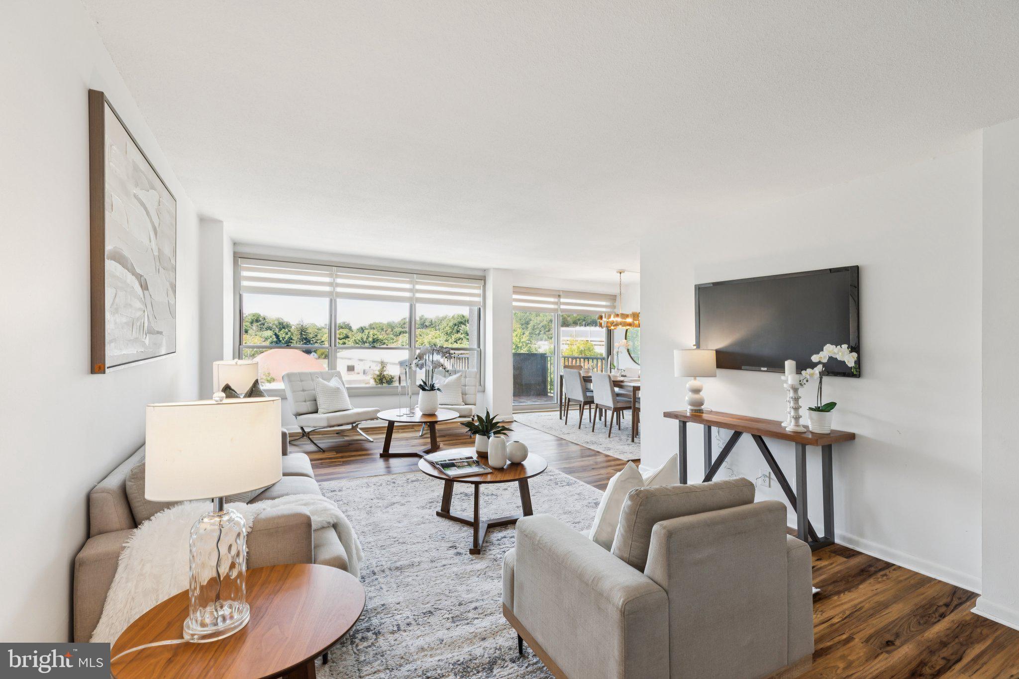 Welcome to Unit W811 in The Green Hill’s West Building—1,222 square feet of sun-filled living space where west-facing light pours through expansive windows in every room. Featuring updated luxury vinyl plank flooring, abundant storage, and a bright, open layout, this residence offers the perfect blend of comfort and warmth—truly a place to call home. Step inside to a spacious open-concept living and dining area, ideal for both everyday living and entertaining. From the dining space, sliding glass doors open to a private balcony—perfect for enjoying morning coffee or unwinding at the end of the day. Adjacent sits a well-appointed kitchen with cream cabinetry and natural-toned countertops. The second bedroom, just off the dining area, features a walk-in closet, custom blackout shades, and a newly installed sliding farmhouse door, making it equally suited as a guest room, home office, or cozy reading nook. A full hall bath with tub-shower combo and vanity is easily accessible, while the hallway itself is lined with closets, built-in cabinetry, and a convenient washer and dryer. At the end of the hall, retreat to the primary suite with a full wall of closets and an updated en-suite bath, showcasing a walk-in shower with custom glass doors and decorative gray tile flooring. Unit W811 is a thoughtfully designed home that balances function and coziness, offering flexible spaces to fit your lifestyle—all within the amenity-rich Green Hill community. Additional features include a private storage unit in the basement and access to amenities, including 24/7 security, indoor and outdoor pools, tennis courts, a fitness center, complimentary shuttle service, and more. The monthly condo fee conveniently covers all utilities, basic cable, trash, snow removal, and grounds care. Beautifully maintained and ready to welcome its next owner, this home is the perfect opportunity—schedule your showing today.