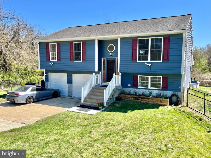 Rare opportunity to grab a nicely maintained and constantly updated home with some privacy and some land, almost 3/4 acre.  Well-located in Glen Burnie so close to easy commuting and shopping.  Open floor plan living, vaulted ceilings, refreshed interior paint, oversized 2-car garage, huge yard.  New HVAC heating/cooling system w/warranty (2019), updated kitchen appliances (2017), new exterior siding w/warranty (2019), new basement patio (2019), new yard fencing (2019), new custom LED interior lighting and smart-home wi-fi control (2022), new hardwood flooring on main level (2022).  Roof only ten years old.