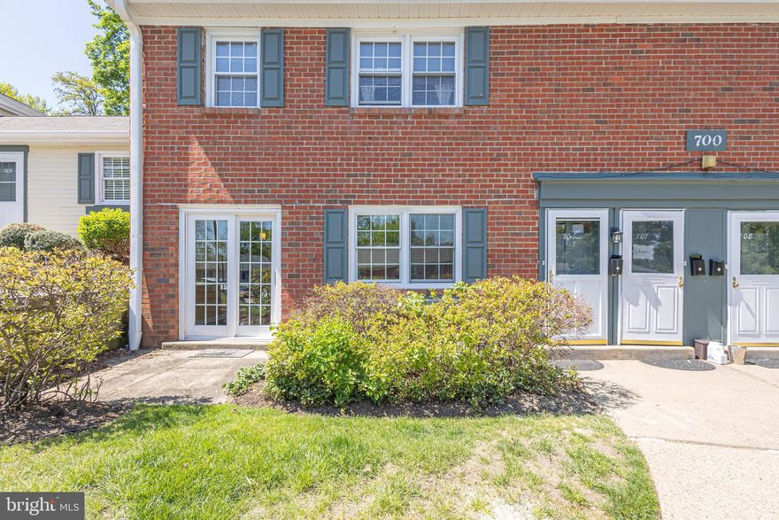 This totally updated, 1st floor home in Yardley Commons offers 2 very large bedrooms, 2 fully updated baths, and a modern, wide open floor plan featuring a  remodeled and gorgeous kitchen. Fully renovated in 2013,   what was a wall is now a beautiful breakfast bar. and creates a large bright open area throughout the kitchen, living and dining rooms.   High end finishes and accents such as granite countertops, stylish cabinetry, pendant lighting and tile backsplash combine to create an unmistakably elegant look.  The hardwood flooring continues throughout the unit, along with recessed lighting to create a wonderful flow from room to room.  From the dining room, a set of french doors leads to a lovely patio perfect for  dining or just hanging out.  The primary suite with ensuite bathroom offers privacy and luxurious step in shower and double sink vanity.   The head(s) of household will love their private retreat. The 2nd bedroom is large in it's own right and enjoys the home's 2nd, stylishly updated full bathroom (with tub/shower). 
With it's location just steps from the restaurants, activities and gathering spaces in Yardley Boro and set just above the Delaware Canal and Towpath,  close proximity  trains and highways  to  nearby Philly and New York, and access to the renowned Pennsbury School District,  this home will not be on the market for long.