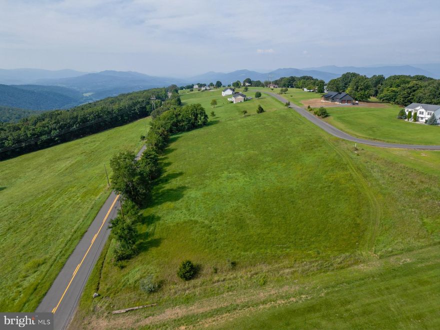 Discover the beauty of Lot 25 Brynner Drive, nestled in the highly desirable Orchard View Estates of Petersburg, WV. This 3.11-acre gem offers the perfect setting for your dream home—whether you're planning a peaceful retirement retreat or a relaxing second getaway.

The gently sloped terrain is ideal for a walkout basement design, giving you both functionality and elevated views of the surrounding mountains and wide-open skies. Imagine relaxing on your deck under a blanket of stars with unobstructed views of the Milky Way—no city lights, just nature's brilliance.

Situated on a quiet, low-traffic road with public water, electric, and high-speed fiber optic internet available, you'll enjoy modern conveniences without sacrificing peace and privacy. Neighboring homes are thoughtfully spaced out, giving you the freedom to enjoy your yard without feeling boxed in.

You're less than five minutes from downtown Petersburg, where you'll find shopping, restaurants, fuel stations, a public pool, and local parks. Just 20 minutes away, Moorefield offers additional amenities including a Super Walmart. For outdoor lovers, the South Branch of the Potomac River is a quick five-minute drive—perfect for kayaking, fishing, or cooling off with a swim. And when you're up for an adventure, Blackwater Falls and Dolly Sods are only 50 minutes away, with Winchester, VA just 1 hour and 30 minutes down the road.

Don’t miss your chance to build in one of Grant County’s most sought-after neighborhoods. Come see what all the fuss is about—your mountain oasis awaits!