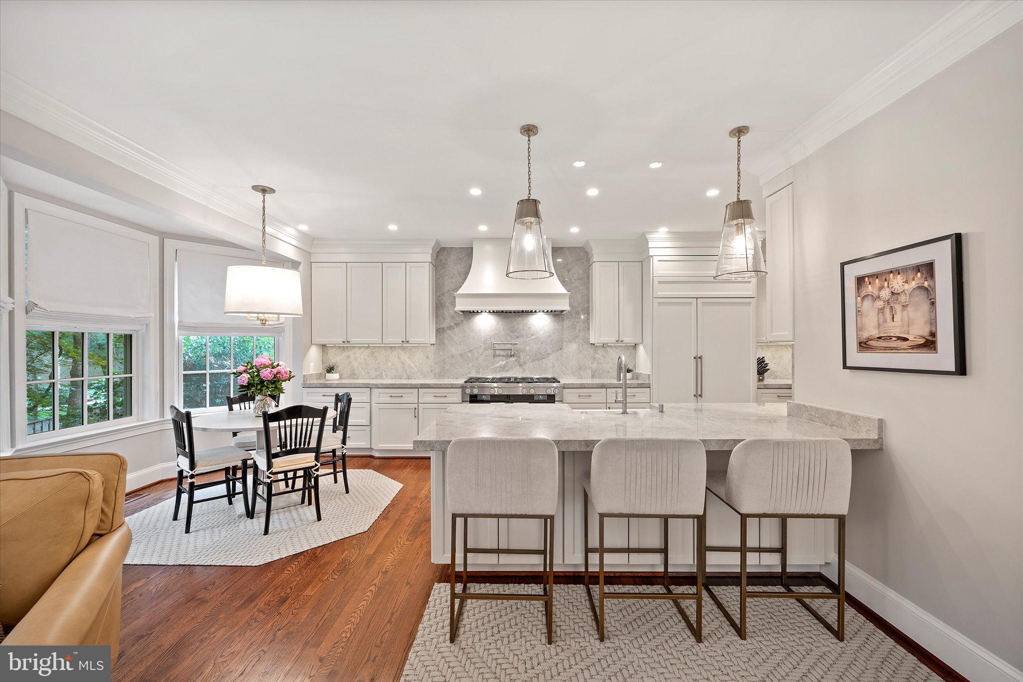 Stunning and updated 3-bedroom, 3.5-bath Georgian colonial townhome with a 2-car garage in the private, fenced community of Mayfair of McLean. **$250,000 recent renovations to include all new windows. This home offers over 4,000 sq ft across three spacious levels with an open floor plan ideal for entertaining. The main level features a gourmet kitchen with walk-in pantry, opening to a cozy family room with gas fireplace. A formal dining room flows into a grand living room with marble-surround fireplace and large windows.
Upstairs includes a luxurious primary suite with walk-in closet and spa-like marble bath, plus two additional bedrooms and a second full bath. The lower level offers a large family room with built-ins and wet bar, a third full bath, laundry room, extra storage, and walk-out access to a private patio with water feature and low-maintenance garden. Located just 1.5 miles from the West Falls Church Metro and minutes from Tysons and Arlington.
**See features page for all the upgrades. This is one or a kind and the best location in Mayfair of McLean!