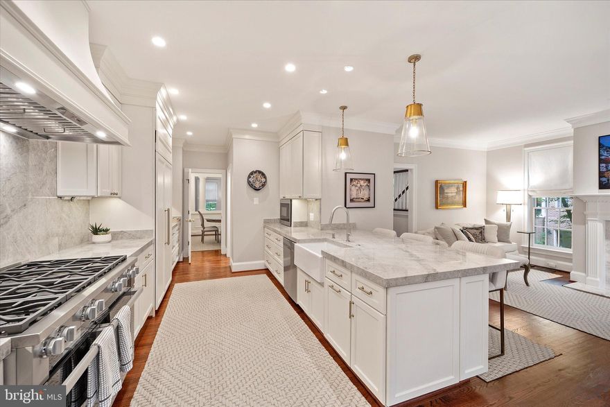 OPEN HOUSE CANCELLED. Under Contract.  

$350,000 in recent renovations to include all new windows , a dream kitchen and much more. **See features page for all the upgrades. This is one or a kind and the best location in Mayfair of McLean!

Stunning and updated 3-bedroom, 3.5-bath Georgian colonial townhome with a 2-car garage in the private, fenced community of Mayfair of McLean. This home offers over 4,000 sq ft across three spacious levels with an open floor plan ideal for entertaining. The main level features a gourmet kitchen with walk-in pantry, opening to a cozy family room with gas fireplace. A formal dining room flows into a grand living room with marble-surround fireplace and large windows.

Upstairs includes a luxurious primary suite with walk-in closet and spa-like marble bath, plus two additional bedrooms and a second full bath. The lower level offers a large family room with built-ins and wet bar, a third full bath, laundry room, extra storage, and walk-out access to a private patio with water feature and low-maintenance garden. 

Two possible locations have been designated for an optional elevator installation, providing flexibility for future needs. 

Located just 1.5 miles from the West Falls Church Metro and minutes from Tysons and Arlington.