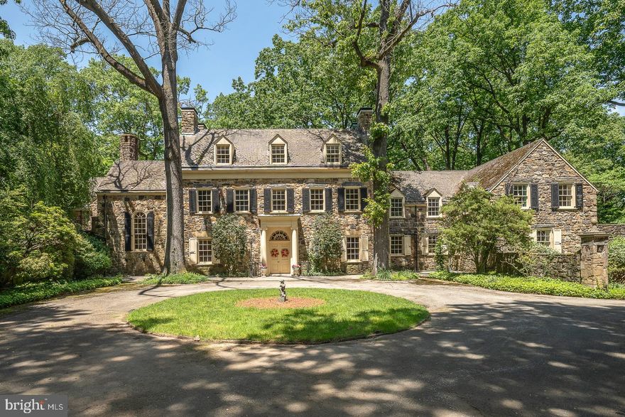 Wayne, 19087. Rare offering. A highset 6+acre 1920's estate compound with the ultimate luxury of total privacy. Georgian Colonial manor house and estate sanctuary has wild, forested woodlands, formal, sunken gardens, tennis court, and pool w pool house, none of which can be seen from the street. The long drive leads to a delightful, walled court yard with circular drive at front approach to the manor house, a grand Pennsylvania fieldstone colonial of approximately 9,000 square feet. The manor house has endless 1920's scale, elegance and amenities, including the barrel-vaulted transverse entrance hall, formal step-down reception rooms with soaring ceilings and fireplaces,  quarter sawn hardwood floors, a graceful spiral stair rotunda, hand-paneled library, breakfast room and dressing room of tiger maple, a hidden cloak room and service bar for entertaining and spacious outdoor covered and open patio spaces, all with incredible views. This family compound includes a detached, four car heated garage with a chauffeur's two bedroom apartment above with full bath, laundry and kitchen.  Swimming pool and poolhouse has dual changing rooms, bathrooms and a kitchenette.