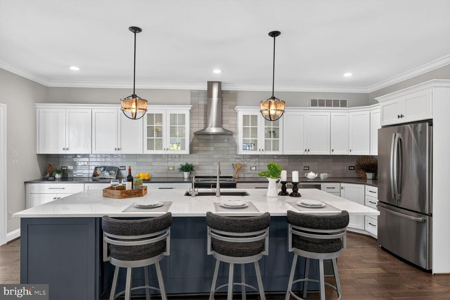 Step into effortless luxury with this rare opportunity to own one of just 16 villas in the prestigious Brightwood Club — a private, gated 62+ community nestled in the heart of scenic Greenspring Valley, just minutes from Johns Hopkins at Greenspring, the Beltway, upscale shopping, and fine dining.
Fully remodeled in 2021, this sophisticated two-story villa offers over 2,100 square feet of beautifully designed main-level living, ideal for true single-floor convenience. Gleaming hardwood floors flow throughout an open-concept layout anchored by a chef’s dream kitchen featuring a massive island, sleek finishes, and seamless connection to the light-filled living room with a cozy gas fireplace.
A sun-drenched sunroom wrapped in floor-to-ceiling windows provides the perfect space to relax and unwind, while the expansive deck overlooks a tranquil, tree-lined setting. The main level also features two spacious bedrooms with spa-like en suite baths, along with a versatile bonus room ideal for a formal dining space or private office, plus a stylish powder room. A private elevator leads to the fully finished lower level, offering exceptional flexibility with a second fireplace, expansive recreation space, third en suite bedroom, generous storage, and walkout access to a peaceful patio. A whole-house generator provides added comfort and peace of mind. At Brightwood, everyday living feels like a resort experience. Residents enjoy an unmatched suite of amenities including chef-prepared daily meals, weekly housekeeping and linen service, 24-hour concierge and security, transportation services, lawn and snow care, and a full calendar of social, cultural, and wellness activities. The clubhouse features a heated indoor pool, hot tub, fitness center, and more, with optional services such as salon treatments, personal training, and in-home dining. This is more than a home — it’s a refined, maintenance-free lifestyle designed for comfort, connection, and ease. Rarely available and highly sought after, this villa is your chance to experience Brightwood living at its finest.