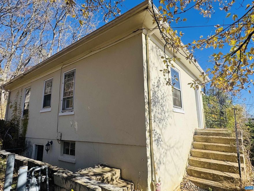 Fixer upper alert!  Are you looking to build your rental portfolio?  This would be the perfect addition.  It sits on top of a hill, which creates a wonderful view overlooking historic homes and even offers some mountain views.  Within a few blocks of downtown Staunton, this home offers 3 bedrooms and 1 bath on the main level, and a full walkdown/walkout basement with tons of potential.  There is already a bathroom plumbed in the basement as well as a laundry room and room for another bedroom as well (or a great secondary living room).  With over 2000 sq feet offered, you cannot beat this price-even though it does need work.  Come see today and create your own Westside Story!,Formica Counter,Wood Cabinets,Fireplace in Living Room