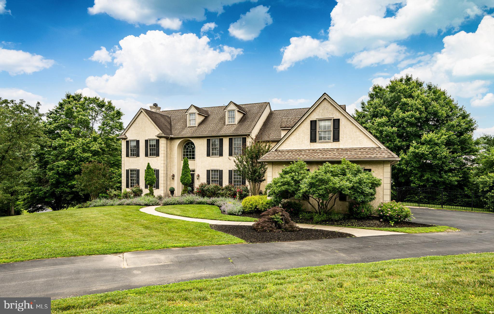 Simply stunning is how to describe 4 Taylor Chase Lane best. The home is situated on top of a hill with beautiful views over the surrounding countryside, in an enclave of just four homes on a private road. No detail from the gorgeous hardwood floors, high ceilings, crown moldings, and more has been missed. On the main floor is a living room, dining room, and family room with a vaulted ceiling and fireplace. The home office is spacious, private, and has a fireplace. The large kitchen features Wolf appliances and a large breakfast room overlooking the backyard. There is a large deck off the kitchen.
The upper floor has a primary suite with a sitting area that offers a large window overlooking the rolling fields. There is also ample walk-in closet space and a great en-suite bathroom.
The second and third bedrooms share a jack-and-jill bathroom. The fourth bedroom has a full en-suite bathroom. The flex space would be good for a fifth bedroom, home office, or more.
The lower level has a large rec room, full bathroom, workout area, fireplace, and French doors leading out to the patio and custom stone pool. The backyard is a beautiful escape where you can relax by the pool. Located in the award winning Unionville-Chadds Ford school district with easy access to Rt 202, Rt 1, West Chester, Wilmington and Philadelphia.