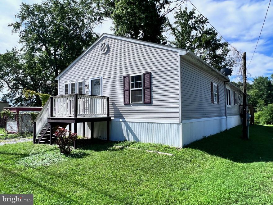 Affordable water oriented opportunity!!! 2-bedroom, 2 full bath manufactured rancher offering 1,792 sq. ft. of living space and situated in the water-oriented community of Charlestown Manor with close proximity to Rt 40, I-95 and Harford County. Highlights include attractive laminate flooring throughout, a spacious eat-in kitchen with an island, 26' X 13' living room, primary bedroom with a walk-in closet and updated primary bathroom, second bedroom, office (no closet), second full bath, laundry and sprawling 45' X 8' covered deck. Ideal for entertaining or relaxing after a long day. Just steps from the North East River and deeded water rights, Charlestown Manor Community details include riparian rights, a community pier, mooring rights, waterfront park and sandy beach. (Charlestown Manor Beach Association HOA has a voluntary fee of $50.00 yearly) A short distance away are the quaint and historical towns of Charlestown and North East, Maryland, where you'll find waterfront parks, marina's, charming shops and restaurants offering a vast array of casual and fine dining. A perfect year long residence or summer getaway! If you are searching for an affordable, well-kept home in a water-oriented community, your search is over...43 Edgewater Avenue...Welcome Home!!!