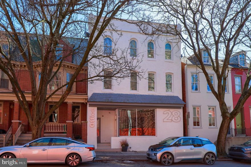 Join the new Southern Market and upcoming Willow Valley Mosaic tower neighborhood!  Fantastic mixed use investment opportunity with large parking lot.  Perfect for an owner occupant or small business owner to live or work, collecting apartment income, or use as a traditional investment property and capitalize on premium rents due to flexibility of use of space, excellent property condition, and central location. The first floor commercial space offers over 2,200 square feet, is ready to be built out to suit, and features freespan ceilings, exposed brick wall, and rear access to the parking lot.  Ideal for office, gallery, yoga or fitness studio, coffee shop and many other uses. The 2nd and 3rd floors feature two fully leased stylish apartments that were completely renovated in 2015/2016 and are producing steady income. Both apartments feature original hardwood floors, granite kitchen counters, stainless steel appliances, in-unit laundry, mini-split heating/cooling units and all-new windows. All spaces feature separate hot water, electric, and gas utilities. At the rear of the building is a lighted 17 space parking lot, accessed by South Christian Street with leased spaces producing additional income. Located a block away from Lancaster's Penn Square, you are within walking distance of all of Lancaster City's major attractions including historic Central Market, Fulton Opera House, Lancaster Convention Center, and countless shops and restaurants.