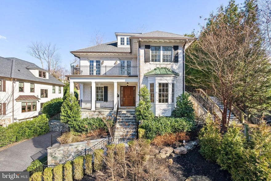 Sited on a serene street in Wesley Heights abutting and overlooking picturesque Battery Kemble Place, offers a unique opportunity to live in what feels like to live in a forest!  And the perfect spot for all dog lovers!! 2935 49th St NW is a significantly sized home boasting 7 Bedrooms, 6 Full Bathrooms, 2 Half Bathrooms, approximately 7,900 total SF across 4 Levels of thoughtfully designed living spaces, and an elevator servicing 3 levels for ultimate convenience. This residence is defined by refined master craftsmanship, and elegant details throughout. A covered front Porch welcomes you into the gracious Main Level with tremendous scale, where a grand Foyer is flanked by a formal Dining Room and Living Room. The Dining Room offers seamless access to a well-appointed Butler’s Pantry, while the Living Room extends into a sophisticated Library. A Gourmet Kitchen outfitted with top-of-the-line Sub-Zero, Wolf, and Miele appliances, a designated Breakfast Room, and adjoining Family Room, open to a private rear Patio, perfect for indoor-outdoor living. The Second Level is anchored by a luxurious Primary Suite with a spa-like marble Bathroom, 2 walk-in closets, and two sets of Frens doors to a private terrace with serene park views. Three additional Bedroom Suites, a Laundry Room, and elevator access complete this level’s offerings. The Third Level offers 2 additional Bedrooms and a hall Bathroom, providing a flexible space for family and guests alike. The Lower Level is designed for recreation and relaxation, featuring a spacious multifunctional Recreation Room with a gas fireplace, a wet bar, and an adjacent Game Room. A 7th Bedroom, additional Full and Half Bathrooms, a secondary Laundry Room, and a 2-Car Garage with direct interior access to a Mudroom, provide ultimate functionality. Located in the coveted Wesley Heights neighborhood, 2935 49th St NW offers a serene retreat minutes from the areas finest dining, schools, and parks. Zoned for Mann ES, Hardy MS, and Wilson HS.