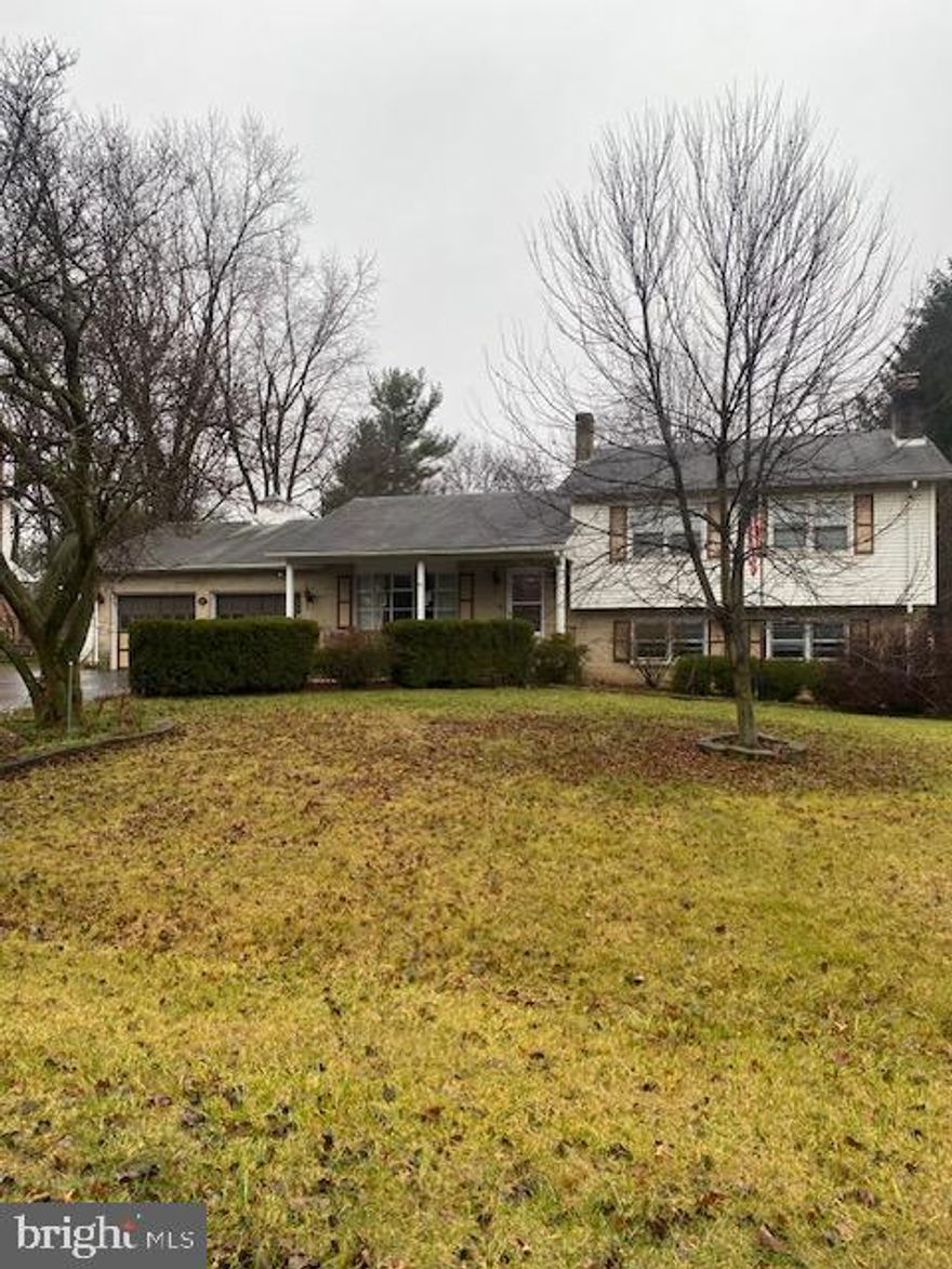 This is a four bedroom three bath split level home. The main entrance features a traditional living room, dining room and kitchen. The back of the property has a sunporch and a deck. The second level features the three bedrooms and two bathrooms. In one of the bedrooms is access to the attic with plenty of storage space. The lower level features the family room with the fireplace,  full bathroom,  the laundry room and a bedroom/office. There is an additional lower level that was used as a wood shop with access to the utilities and a walk up to the garage. The garage also has a work area, this home has plenty of potential.