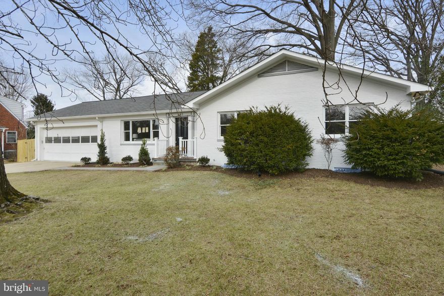 Beautiful renovation on a large level lot just steps from the GW Parkway. Open floorplan features chefs kitchen with granite, stainless and breakfast bar. Main level master has a walk in closet and lux master bath with double vanities and marble accents. Huge finished basement includes a large recreation room, 2 additional bedrooms and full bath. Separate laundry on both levels. Rare 2 car garage!