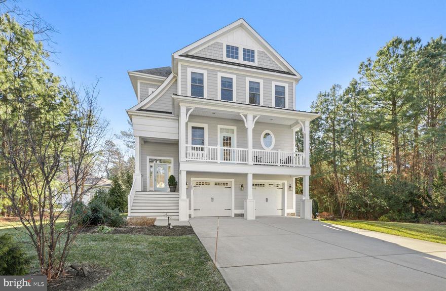 An exceptional opportunity awaits in one of the Lewes/Rehoboth area’s most coveted bayfront communities—Bay Front at Rehoboth. Known for its expansive half-acre ± homesites, thoughtful preservation of mature trees, privacy-oriented home placement, abundant wildlife, and resort-style amenities, this waterfront enclave offers a lifestyle unlike any other. Residents enjoy a spectacular pool overlooking the bay and protected wetlands, a community clubhouse ideal for gatherings, a fully equipped fitness center, and a scenic nature trail that feels like a private sanctuary for bird and nature enthusiasts. Launch a kayak from the community beach, unwind with a glass of wine at the private waterfront gazebo, or simply savor the serenity that defines easy coastal living at its finest. Impeccably maintained and perfectly positioned on a private corner lot, this Schell Brothers Catalina Model offers three levels of thoughtfully designed luxury. With 4 spacious bedrooms and 3.5 baths, the home was designed to embrace its natural surroundings. The main living level is filled with light, featuring expansive picture windows that frame tranquil views of trees and wetlands—where sightings of cardinals, ospreys, herons, and even deer are part of everyday life. The dining area flows seamlessly onto a generous screened porch, creating an elevated indoor-outdoor experience. The spacious kitchen is both elegant and functional, showcasing classic cream toned cabinetry, gleaming granite countertops, stainless steel appliances, a prep island, breakfast bar, and a large walk-in pantry with a dedicated coffee station—perfect for both entertaining and everyday living. A main-level bedroom with en-suite bath and customized walk-in closet completes this floor. The third level is dedicated to 2 additional bedrooms and 1 bath along with a roomy primary suite. This sanctuary features a tray ceiling, dual walk-in closets, and a spa-inspired bath with soaking tub. Step onto the private sun deck for peaceful mornings or sunset relaxation where you catch a glimpse of the Rehoboth Bay! The ground level offers a two-car garage, ample storage, and a conditioned flex space currently used as a fitness room, workshop, and art studio yet easily adaptable to suit your personal lifestyle needs. Outside, the private yard, oversized storage shed, and dedicated golf cart parking provide thoughtful finishing touches to this truly exceptional home.