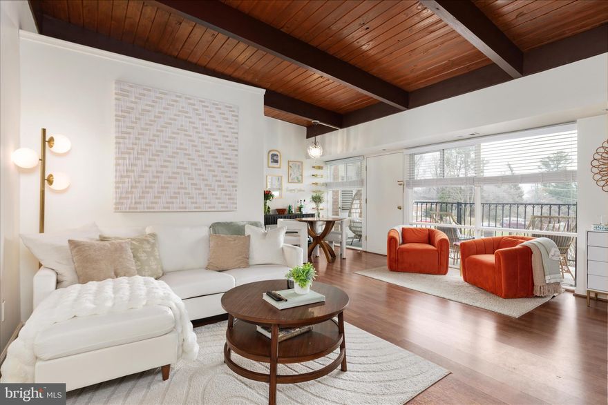 Centrally located and rarely available, this top-floor, corner-unit 3-bedroom condo with vaulted ceilings is filled with natural light and overlooks peaceful garden views. The spacious living area showcases natural wood ceilings with exposed beams, creating warmth, character, and an airy architectural feel rarely found in condo living. Large windows fill the home with light and open to a private balcony, perfect for morning coffee or relaxing with a glass of wine at the end of the day. The updated kitchen features modern cabinetry, granite countertops, and stainless steel appliances, including a 5-burner gas stove. Updated lighting fixtures and fresh finishes throughout give the home a bright, move-in ready feel. The generously sized primary bedroom offers expansive windows, plush carpet with extra padding (2020), a walk-in closet, and a professionally installed closet system. Two additional bedrooms are also spacious and feature custom closet systems for excellent storage. Additional highlights include a new HVAC ($10K), three parking permits plus visitor passes, and additional storage. Residents enjoy access to secure, well-maintained laundry facilities, a community pool, grilling area, picnic tables, and a tot lot. Ideally located just inside the Beltway, the home offers easy access to I-495, I-66, and I-395, and is minutes from INOVA Fairfax Hospital, George Mason University, and Northern Virginia Community College. The condo fee includes all utilities except electricity, adding convenience and value to this turnkey, move-in ready condo.