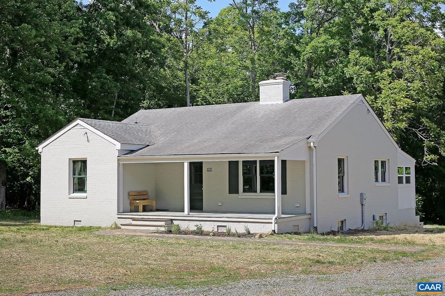 Move-in Ready Keswick Cottage! Set on over 7 acres, this beautifully renovated 2 bedroom home is located within the picturesque Keswick area of Albemarle Co. A close drive from the Route 231 craft beverage trail. The home is a 15 minute drive to the town of Gordonsville, and under 11 miles from I-64, the Pantops area, and the Rivanna River Trail. Downtown Charlottesville and the University of Virginia are less than 15 miles away.  The 1,176 sqft home was built in 1962 and offers recently reimagined spaces, a welcoming front porch, refinished hardwood floors, a living room with a brick fireplace, a cozy sitting room, and a gourmet kitchen equipped with granite countertops, stainless steel appliances, and a center island with seating. Adjacent to the kitchen, a sunroom provides a lovely spot to enjoy your morning coffee or a meal. Two bedrooms and an upgraded bathroom with a walk-in tile shower are set off of the living room. A stack front-load washer and dryer are provided.  A full, waterproofed basement offers storage space and a half bath. The home's exterior includes a rear patio with outdoor seating, a stone path leading to the detached 2-car garage, and a large open field with wildflowers to the right of the home.