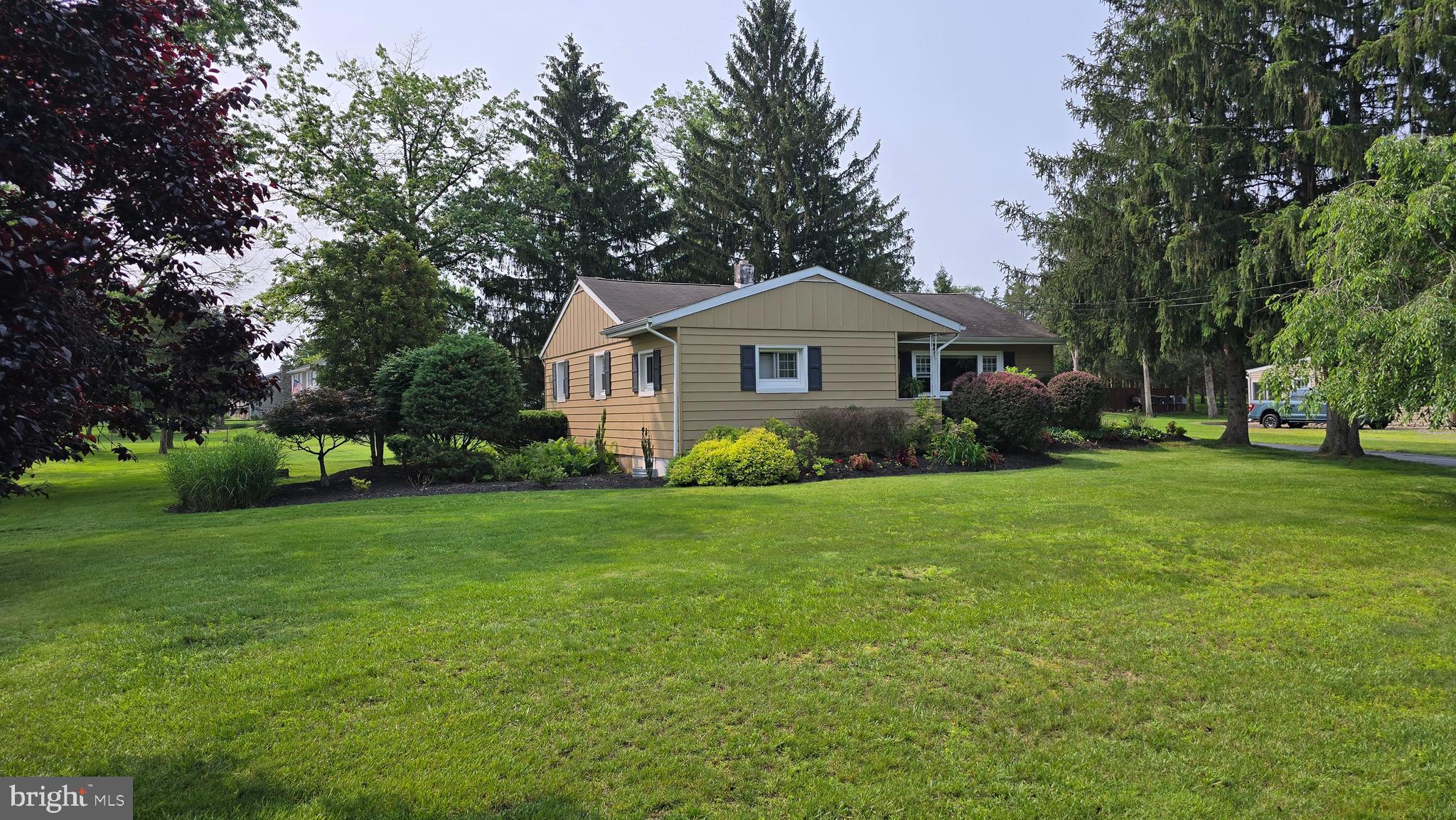 Tucked away on a quiet no-outlet road, this one-story ranch is a rare find offering peace, privacy, and a front-row seat to nature. Featuring 3 comfortable bedrooms and 1 full bathroom, this home is perfect for those seeking a simple, serene lifestyle in an unbeatable location. The interior is bright and welcoming, with large windows that flood the home with natural light. A fully finished basement expands your living space, providing flexibility for a media room, hobby area, or extra storage. Stay cozy all year with a charming wood-burning stove and multiple heating options to suit your preferences. Outdoors, the property shines with beautifully landscaped flower beds and a hidden oasis of a back deck—ideal for quiet mornings or evening gatherings. A shed offers added convenience for storage or gardening needs. The home sits on a well-positioned corner lot directly across from Green Lane Park, giving you quick access to trails, open space, and recreational opportunities. Families will love the easy walk to both Upper Perkiomen High School and Middle School, while anyone can appreciate the calm surroundings and thoughtful care that have gone into maintaining this property. This is more than just a home—it's a peaceful escape, perfectly nestled in nature with every essential close at hand.
**Space for a garage if wanted and possibility of 2nd bath in the basement.**