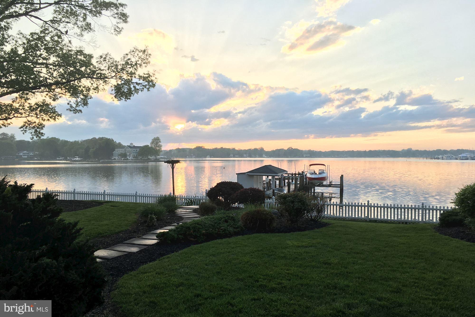 Stunning sightlines + breathtaking sunsets from this waterfront property welcome you to indulge in the beloved Chesapeake Bay lifestyle that many adore! 238' of frontage, a 170' private pier (w/ electric boat lift) + an approx 1 acre flat lot just off of South Creek make for a coastal haven enviable by many. 5BR/4.5BA + 6020 SF, prime for large-scale entertaining! Contemporary finishes. 3-car gar.