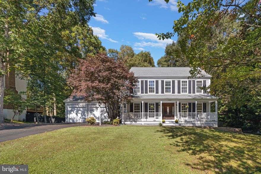 This beautifully appointed, move in ready home with over 3500 finished square feet, features 4 bedrooms/ 3.5 bathrooms, a fully finished basement and so much more!   From the moment you drive up, you will be delighted with the wonderful curb appeal and welcoming front porch that is adorned with a swing to soak in seasonal enjoyment!  Upon entering the home, you are immediately greeted with a 2-story foyer and stunning hardwood floors that flow throughout the main level as well as the 2nd level.  A contemporary open concept kitchen, with granite counters, a farm sink and richly colored wood cabinetry opens to an illuminous sunroom/family room!  The sunroom/family room is designed with a beautiful wood cathedral ceiling and large paned windows allowing for generous views of the tree lined backyard!  The main level also features a separate dining room and large living room with floor to ceiling windows as well as a featured bay window!  With a double door entry, the primary bedroom offers 2 walk- in closets and an en-suite bathroom that features extra storage, a separate shower and oversized soaking bathtub which sits under 2 architectural skylights that adds to the character of this relaxing space.  All the bedrooms upstairs feature hardwood floors and ceiling fans.  All the full bathrooms feature tile flooring, updated vanities and lighting, tile surround showers.   But wait...there's more!   The impressive finished basement boasts additional living space that includes a recreation/family room, large bonus room (that can be used as office space), an eat-in kitchenette, 4th bedroom and the 3rd full bathroom.  The kitchenette features plenty of cabinet space, sink, refrigerator and a countertop burner!   And Yes...the walkout basement has its own private entrance so it can double as an in-law suite or more!  In the fenced in backyard, you will enjoy a stamped concrete patio that overlooks your backyard space as well as a quiet area that showcases a firepit!     Throughout the home you will find great storage!   This beauty is a Must See!