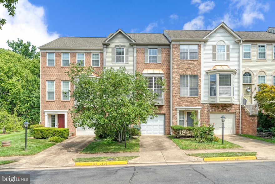 Beautiful, well-lit, brick front, garage townhome in the very sough- after Lowes Island community.   Open layout with tree spacious bedrooms on the top floor.  Large living room with a fireplace with access to the deck.  Updated eat-in kitchen with granite countertops.   Basement with a half bathroom and access to the private backyard.  Lowes Island amenities include  multiple pools, fitness center, a party hall and much more.  Must see today.