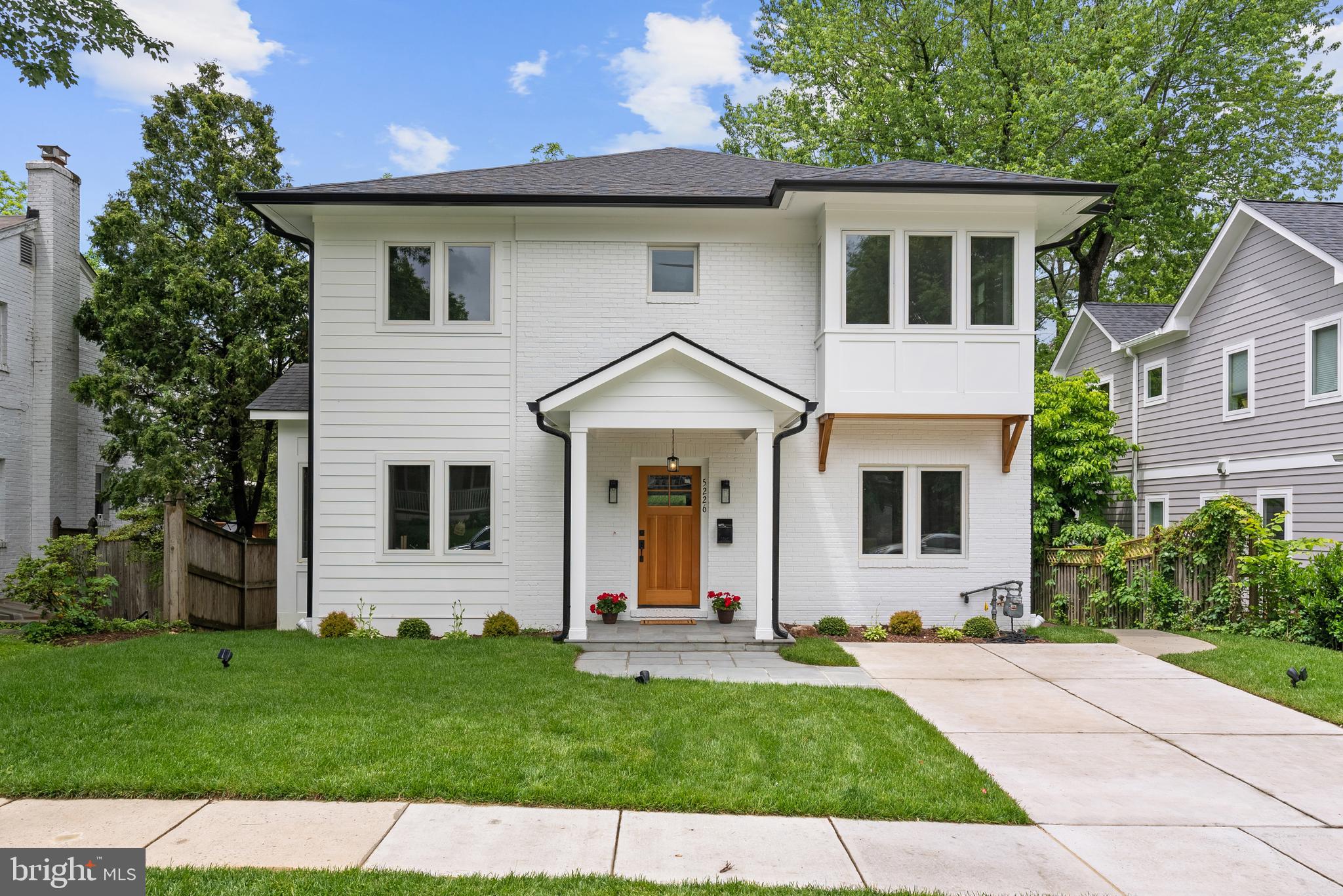 Welcome to 5226 Baltimore Avenue – a spectacular 2025 renovation that defines urban-suburban living, just steps to D.C. With custom finishes and a boutique-builder approach, this Bethesda home stands apart from the mass-produced designs seen elsewhere. A property as unique as it is functional – designed in collaboration with award-winning architect Van Franke – it delivers the best of all worlds: easy access to downtown Bethesda, Friendship Heights Metro, shopping, and restaurants, all while maintaining a suburban charm.
This 4,150 square-foot home features six bedrooms, four full baths, and superb flow across multiple indoor and outdoor spaces. Soaring ceilings and generous room sizes add to the luxury feel, while elegant fixtures and premium finishes elevate every detail.
The kitchen is a chef’s dream: gleaming quartz countertops, state-of-the-art appliances, a custom center island with a breakfast bar and pendant lighting, and a sun-drenched breakfast area. Open to the family room featuring a gas fireplace and coffered ceiling, this area flows effortlessly out onto the rear deck with views of mature trees and a beautifully landscaped, fully fenced-in backyard.
The main level also features a guest bedroom or office with an en-suite bath, dual closets, and custom tile floors. Plus, a mudroom with built-in cubbies ensures an organized entry from the side entrance.
Upstairs, the primary suite is a dream with a large custom walk-in closet and a spa-like bath featuring a soaking tub and dual sinks. Bathed in light with oversized windows throughout, there are three additional bedrooms and a stunning hall bath with double sinks and custom tilework.
The light-filled walk-out basement is a highlight, offering an expansive entertainment area with a custom coffered ceiling in the family room, plenty of light throughout, and direct access to the backyard patio. A sixth bedroom, ideal for a nanny or in-law suite, a full bath, laundry, and ample storage.
Outside, BBQs and dinner parties are practically effortless on the large deck and covered flagstone patio. With lush landscaping and a fenced backyard, along with the private driveway for off-street parking, this is a home designed for those who appreciate location, easy living, and a luxury lifestyle.
Green Acres in Bethesda is known for its unique blend of suburban tranquility and urban convenience. This close-knit community offers a peaceful retreat with tree-lined streets and tidy yards, providing residents with a serene environment. 5226 Baltimore offers easy access to a variety of shopping, dining, and entertainment options. Steps to the Capital Crescent Trail, Friendship Heights Metro, shopping, and dining; close to Spring Valley (D.C.). And bonus – no waitlist for Little Falls Swimming Club (inquire with agent). Inbounds for Westbrook, Westland, and B-CC schools. Ideal for those who want the perfect-sized custom home for today’s lifestyle.