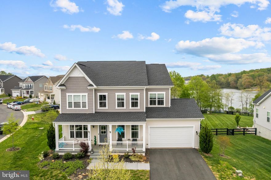 Elegant Colonial Home with Lake Views in Round Hill

Welcome to this stunning lakefront Colonial-style home in the heart of Round Hill. Built in 2022, this spacious residence features 4 bedrooms, 2.5 bathrooms, and approximately 4,754 square feet of beautifully finished living space.

The kitchen is outfitted with premium KitchenAid stainless steel appliances, and a Trex deck off the back of the home offers a peaceful spot to relax and enjoy breathtaking lake views.

Upstairs, you'll find a convenient laundry room. The home also includes smart technology for easy control of lighting and climate, and it’s located within a top-rated school district, ideal for families.

The walkout basement is pre-wired for a sound system and plumbed for an additional bathroom, offering excellent potential for future expansion or a custom entertainment space.

Situated in one of Round Hill’s most desirable and quiet neighborhoods, this home provides access to boating, kayaking, and fishing just minutes from your door. The serene backyard with beautiful water views makes this property a true retreat.