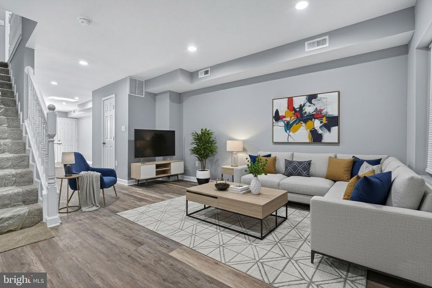 Discover a meticulously renovated residence where contemporary style meets everyday functionality. This property has been thoughtfully redesigned to offer an open-concept, modern living experience with high-end finishes throughout. From the striking kitchen to the designer bathrooms and versatile lower level, every detail has been curated for comfort and aesthetic appeal.
The main floor is an inviting showcase of open-concept living, featuring chic, durable wood-look flooring that spans the entire space. The heart of the home boasts brilliant white Shaker cabinetry, pristine white quartz countertops, and a suite of sleek stainless steel appliances. A central kitchen island with clean lines offers a perfect spot for casual dining and prep work, making entertaining a breeze.
The main living area is awash in a crisp, light gray palette with recessed lighting and bright white trim, creating a modern canvas for your furnishings.  A staircase with a white balustrade and plush carpet leads to the upper level. Step out from the main level to a charming private wooden deck, offering a perfect retreat for morning coffee or outdoor dining overlooking the fenced yard. A stylish half-bath on this level is finished with a modern vanity and round mirror. The upper level is dedicated to comfort, featuring plush, high-quality carpeting in all bedrooms and hallways. Two generously sized bedrooms offer abundant natural light and ample closet space. They are designed as serene sanctuaries, continuing the clean, bright aesthetic of the main floor. The full bathrooms are a stunning highlight, featuring bespoke design with bold blue-gray subway-style tiling in a unique linen texture. Enjoy modern fixtures, sophisticated vanities, and a mix of full tubs and walk-in showers with elegant white hex-tile floors.
The finished lower level includes a separate room that can function as an additional bedroom or private study. A beautifully finished full bathroom on this level features a walk-in shower with the same distinctive blue-gray tile, completing the functional and stylish lower level.
This home is an exceptional opportunity to acquire a fully updated, move-in-ready property designed for the modern homeowner. You won't find anything else at this price point, don't miss your chance and schedule your showing today!