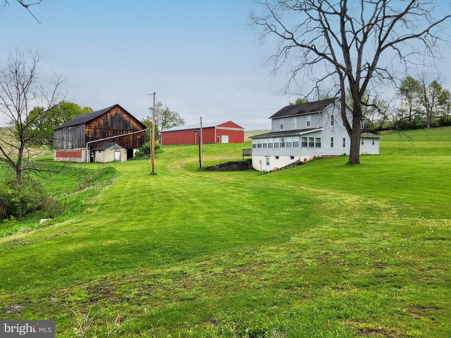 "THE FARM YOU ALWAYS WANTED TO OWN...in Bedford County".  202 acres of Earth Meets the Sky!   Amazing, Inspirational views!   Beautiful year round living and hunting of everything;  turkey, deer, bear- several tree stands in place.    5 bedroom house w/large eat in kitchen, pine wood flooring, sunroom addition to take in daytime views. huge 40x100 utility building & shop.  Old wood bank barn.  Very rural setting, Enjoy open fields with no light pollution for Awesome star gazing!    Includes over 1200' of road and stream frontage.  Gentleman farm.  So many options, only 20 minutes to Jean Bonnet Tavern and downtown Bedford.  Property currently in Clean and Green (taxes reflect*) & CREP programs provides some income and tax savings!
