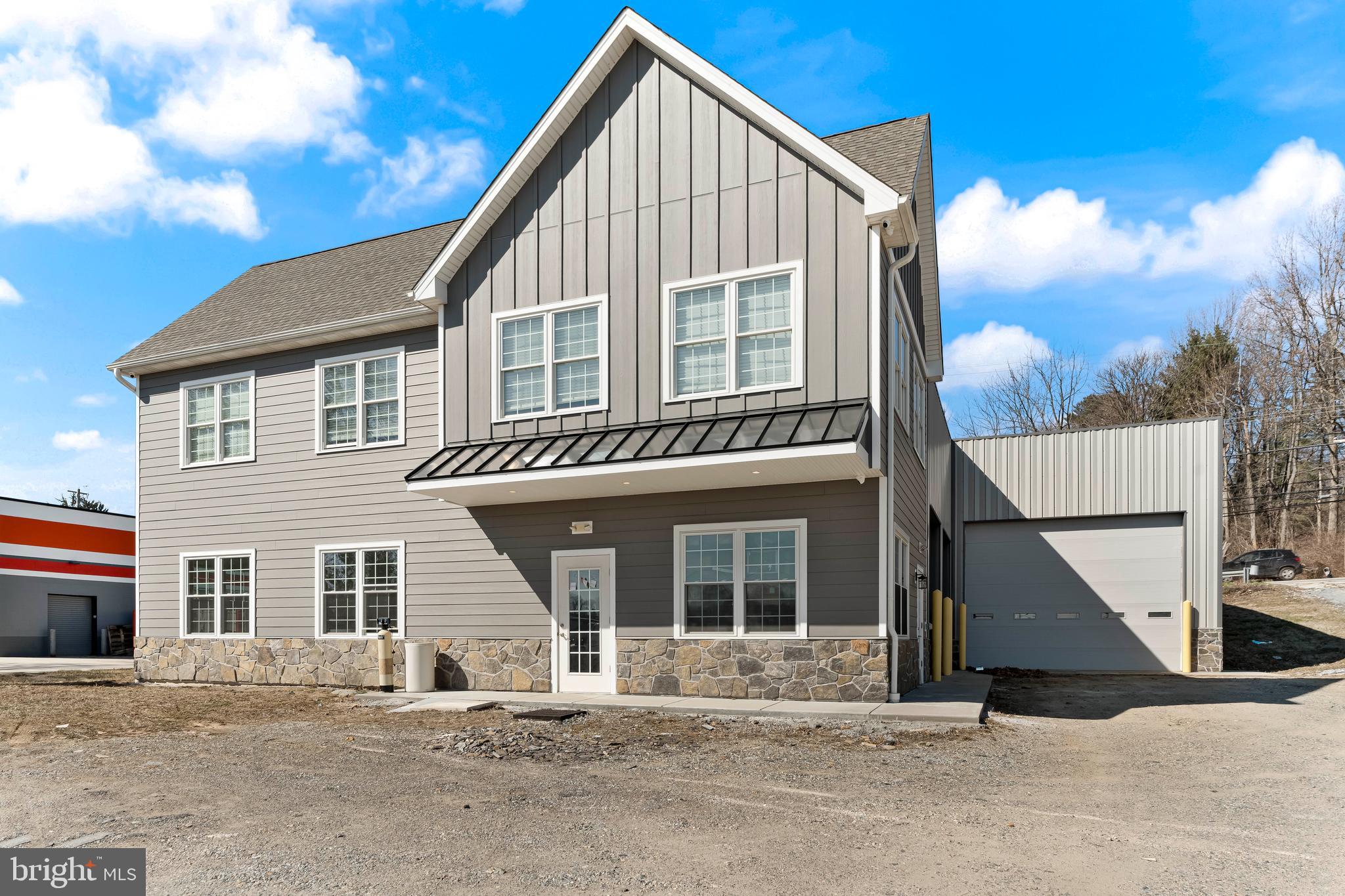 Rarely found 4468 SQ FT Shop with an additional 1728 Sq Ft of Office Space. Perfect for your business to expand and grow! Convenient location near the edge of Kennett Square Borough. Come and join this bustling area! Only 3 years young (built in 2022), the shop features 3 overhead doors, steel clear span construction with 20' ceilings and included shelving racks. Shop also features a small bathroom and direct access to the front office area. Front of the building features beautiful hardiplank siding with real stone and has 848 square feet on each level with a bathroom on each level as well. Great place for a contractor to grow their business! Exterior features parking for 10-12 cars. Access to W. Cypress St, which is very busy road, allows for a great place for signage and advertising for your business. Public Water/Public Sewer/Natural Gas!