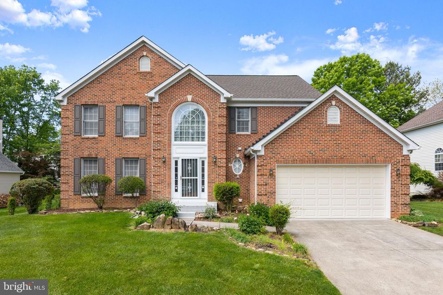 Welcome to this spacious brick-front colonial in the desirable Kings Charter community, offering one of the largest models in the neighborhood with a bright, functional layout and generously sized living spaces throughout. The impressive two-story foyer creates an inviting first impression with hardwood floors and an open staircase, while the main level features multiple living and gathering areas filled with natural light.

The kitchen offers abundant cabinet and counter space and a sunny breakfast room surrounded by large windows overlooking the backyard. The adjacent family room features a wood-burning fireplace creating a cozy focal point for the space. Formal living and dining areas provide additional flexibility for entertaining, working from home, or everyday living.

Upstairs, the spacious primary suite includes vaulted ceilings, a large sitting area, and ample room for lounge or office space. The additional bedrooms are generously sized, and the unfinished basement includes a rough-in for a future bathroom, offering excellent potential for additional finished living space.

Conveniently located near I-95, shopping, dining, and everyday amenities, this home offers both space and accessibility in one of the area’s most established neighborhoods.  New roof & gutters (2025) New siding (2017) Radon mitigation system already installed.