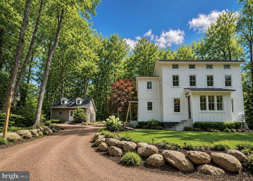 Perfectly perched over three quiet acres on historic Old Windy Bush Rd, this newly built residence offers an exquisite opportunity to experience country living in the heart of New Hope, Bucks County, PA.  Gorgeous designer finishes are showcased amongst all 2,965  square feet of living space, beautifully imagined by Luce Architects and constructed by McGahan Enterprises. Every element within the residence is new, including all mechanical systems and infrastructure. The interior is showcased with rustic wide-plank, oak hardwood flooring, a stone adorned gas fireplace centering the living room, a dining room with backyard access, a state-of-the art- gourmet kitchen w/ a new Thermador appliance package, custom cabinetry & quartzite countertops,  a dedicated laundry room w/ custom built-ins, and three spacious bedrooms with beautifully appointed bathrooms. The Owner's Suite showcases soaring ceiling heights, a generous walk- in closet, radiant heated primary bathroom flooring w/with soaking tub, spacious glass shower and unique ceramic tiling gracing the walls. Outside, a detached two car garage offers additional storage and creative flexibility with a kitchenette and a second floor flex space which includes a full bathroom, ideal for an office, studio or guest accommodations. Immerse yourself in the serene beauty of high-end country living, complete with a lush backyard ready for your gardening touch, favorite pastimes, or even a sparkling future pool.  Nestled just minutes away from the vibrant towns of New Hope and Lambertville, and surrounded by the region's finest attractions, 3503 Old Windy Bush awaits your discovery. Entirely turnkey and incredibly brand new, this property is absolutely amazing ! *Main house is 2,440 sq ft with 3 bedrooms. Detached garage is 525 sq ft with kitchenette, full bathroom and large studio/living/bonus space.