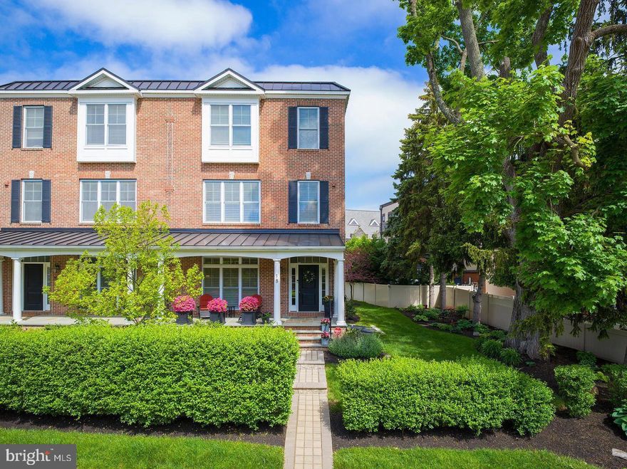 Welcome to 18 S Roberts Road - a beautifully maintained, turnkey twin home in the heart of Bryn Mawr, in the Award Winning Lower Merion Township. This is Main Line living made easy: elegant, spacious, and steps away from Bryn Mawr and Rosemont train stations, top-tier dining,  and everyday conveniences.

Built by renowned Main Line builder Rockwell Custom, this 4-bedroom, 5-bathroom home (3 full, 2 half) offers thoughtfully designed indoor and outdoor spaces, ideal for those seeking low maintenance luxury or looking to downsize without compromise.  

Step inside from the charming front porch and you’re welcomed by a flexible entry-level living space, a powder room, 4 stop elevator and direct access to the attached two-car garage  complete with custom built-ins, a custom epoxy floor and an Electric Car charger. The driveway provides rare additional parking, a true bonus for this style of home.

The main living level is bright and inviting, anchored by a gorgeous & spacious chef's kitchen with a large quartz island and top-of-the-line appliances including a Wolf 6-burner range, double convection ovens, Sub-Zero refrigerator, wine fridge, and Miele dishwasher. This level opens seamlessly to a generous dining area with a gas fireplace and a welcoming light filled living room with a second fireplace, ideal for entertaining or unwinding in style. You'll appreciate the large windows with custom plantation shutters that wrap around the home enhancing both light and privacy.

Step outside to your private 24-foot deck with an electric retractable awning - the perfect spot for morning coffee, al fresco dining, or summer lounging.

The third floor hosts the primary suite with dual custom walk-in closets,  plush carpeting, and a spa-like ensuite bath with double vanities and an oversized glass shower. Two additional bedrooms on this floor also feature custom closets and share a well-appointed hall bath with a tub/shower combo.

Take the elevator or stairs down to the fully finished lower level, complete with a full bath, bonus room for guests or a home gym, plus additional storage.

The manicured front and side yards are maintained by the HOA and include a landscaped garden that adds a splash of greenery and curb appeal year-round. Other great features include Dual Zone HVAC, recessed lighting and crown molding throughout and Low HOA fees that have not been increased since 2018

With a smart layout, premium finishes, generous living space, and unbeatable walkability, this home checks every box for stylish and stress free Main Line living.