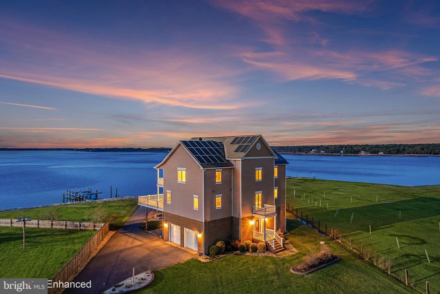 ***This opportunity includes the combined purchase of 1252 Old Madison Rd, Madison, MD and 1250 Old Madison Rd, Madison, MD***

End each day with sweeping sunsets over Madison Bay from this exceptional waterfront compound featuring 268 feet of protected shoreline and approximately 2.83 acres of combined privacy, perfectly positioned with an ideal east-west orientation. Built in 2013, the architect-designed main residence offers over 4,600 square feet across three levels with 4 bedrooms and 4.5 baths, thoughtfully designed to capture unobstructed water views. Beautiful flooring flows throughout, complementing the clean architectural lines and high-end finishes. The walk-in level is designed for entertaining with a spacious living area, sophisticated bar, and full bath. The main level is truly stunning, highlighted by soaring 40-foot ceilings and a dramatic wall of glass framing panoramic bay views. The open-concept design connects the kitchen, dining, and living areas, anchored by a stone fireplace. The gourmet kitchen features a spacious eat-in area that opens to a full-length wraparound deck overlooking the water—perfect for gatherings of any size. An elevator provides seamless access to all three levels. The main-level primary suite offers private deck access and a spa-like bath. An additional full bath is also located on this level. Upstairs, a loft overlooks the main living space, with three generously sized bedrooms, including two ensuite bedrooms with private baths. Outdoor living is equally impressive with multiple decking areas and a beautifully designed paver patio featuring a fire pit and sitting walls. The waterfront includes approximately 268 feet of rip-rapped shoreline and a private pier with boat lift and a seadoo lift.  A gate, public water and sewer, and an oversized two-car attached garage add convenience. Also included is the adjacent property at 1250 Old Madison Road, featuring a cottage-style residence with 2 bedrooms and 2 baths, additional living space, and a separate guest house with multiple bedrooms, baths, and waterside decks . Situated on approximately 1.71 acres, it offers flexibility for guest accommodations, multi-generational living, or future use. A rare opportunity to own a private waterfront compound with expansive views, multiple residences, and exceptional shoreline on Madison Bay.  Mortgage savings may be available for buyers of this listing.