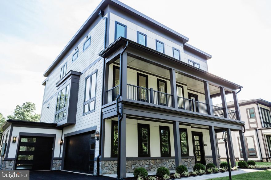 ELEVATOR INCLUDED IN PRICE! FURNITURE INCLUDED!  Great for multi generational living!  Step inside the Fisher model home, curated by Premier Homes Group—a refined display of elegance and sophistication. This masterpiece presents a comprehensive indoor and outdoor living area including garages, summing up to 8,441 square feet. Embracing 1,466 square feet dedicated to covered porches, decks, patios, and balconies, it offers a seamless blend of luxurious spaces. Additionally, the inclusion of a meticulously crafted three-car garage with painted exteriors, epoxy floors, high ceilings, and six-inch baseboards contributes to the overall constructed area, making the total footprint of this home 8,441 square feet. Come see our sales rep, located at 4053 Thornton St., invites you to explore its luxurious features and impeccable design during our open viewing hours from Friday through Monday, 12 PM to 4 PM, and by appointment on Tuesday & Wednesday and Thursday. 

Nestled on a generous 0.34-acre lot, this residence offers a serene backdrop of open space within a charming new development that includes five similar homes. As you enter through the majestic 2-story foyer, the home unfolds with 10-foot ceilings on the main level, creating a spacious and bright ambiance. Every detail has been carefully considered, from the luxurious 7.5-inch European White Oak hardwood floors to the sophisticated moldings, premium lighting, and floor-to-ceiling windows that fill the space with natural light.

The heart of this home is the expansive family room, featuring a dual-sided gas fireplace that warms not only the interior but also the covered porch adjoining the breakfast area. The chef's kitchen is a true masterpiece, boasting sleek white cabinetry with glass fronts and top-of-the-line GE Cafe Series stainless steel appliances, including a 48-inch dual fuel gas range, a convenient pot filler, range hood, built-in microwave/wall oven, and a 48-inch built-in fridge. The center island with a striking waterfall quartz countertop adds a touch of glamour.

Upstairs, discover four bedrooms, each with its own private en-suite bathroom. The luxurious owner's suite is a retreat in itself, offering a cozy sitting area with a gas fireplace, a screened porch, two walk-in closets, and an opulent en-suite bath featuring a freestanding soaking tub, dual water closets, and a spacious, frameless glass ultra walk-in shower with a built-in seat.

The lower level is equally impressive, featuring a 3-stop elevator, an additional bedroom with a full bath, a family room with a dual-sided gas fireplace opening to a vast covered flagstone patio, a wet bar, and a second laundry room. Quality is evident in every aspect of this home, from structural components to the smallest details.

Situated in a prime location, Red Oak Manor offers easy access to major highways like 495 and I-66, and is close to a variety of shopping, dining, parks, and entertainment options. Experience luxury living in a friendly community at Red Oak Manor. Don't miss the opportunity to make this exceptional property your home. Visit us during our open viewing hours or schedule a private appointment today.  Google Premier Homes Group LLC.  in Northern  Virginia.