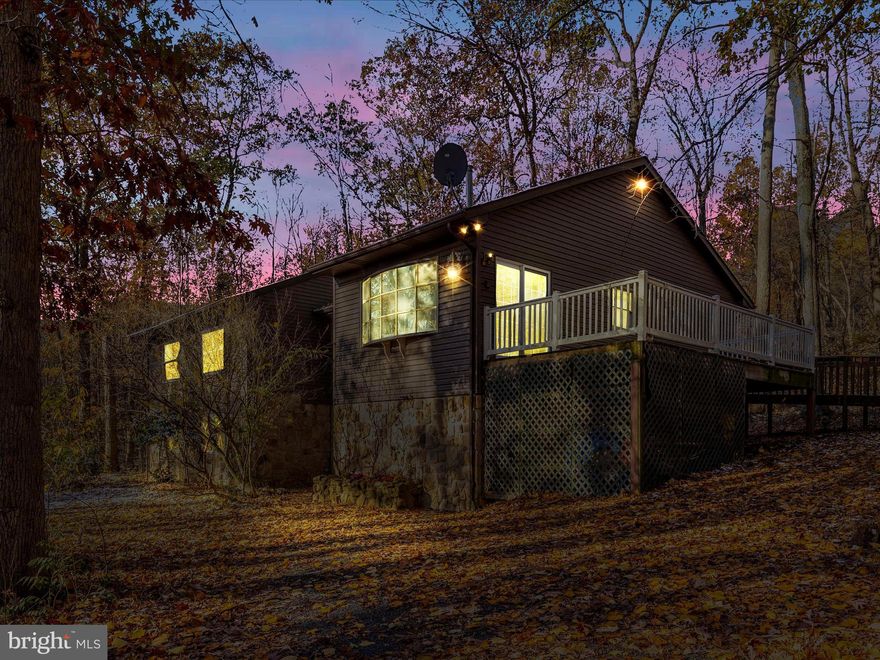 Welcome to 5101 Wigviille Rd, Thurmont, MD - where this contemporary raised ranch style home meets the tranquility of nature. This spacious 4-bedroom, 3-full bath home is a rare gem, boasting an estimated 3908 sq ft of living space, a finished lower level with in-law suite, and an exceptional location on 4.22 wooded acres near Cunningham Falls State Park and Catoctin Mountain State Park.
Enjoy the spacious living with four bedrooms designed for comfort, style, and relaxation. The primary suite offers a private bath and enclosed sun porch for your private retreat. Convenience is paramount with three full baths, offering plenty of space and convenience.  The finished lower level is a fantastic in-law suite or guest space that includes a full kitchen, living room, bedroom, full bath, and an office. It's a versatile space that can accommodate guests, extended family, or serve as a private retreat. Embrace the beauty of nature on your own 4.22 wooded acres. Located near Cunningham Falls State Park and Catoctin Mountain State Park, you'll have hiking trails, picturesque views, and the wonders of the great outdoors just minutes away.  Savor the serene surroundings on your deck providing the perfect spot for morning coffee, afternoon relaxation, and evening stargazing. This property offers the best of both worlds - a peaceful escape in the woods while still being conveniently located near amenities and recreational opportunities. The home's generous living space, the in-law suite, and the picturesque surroundings make it the ideal place to create lasting memories.