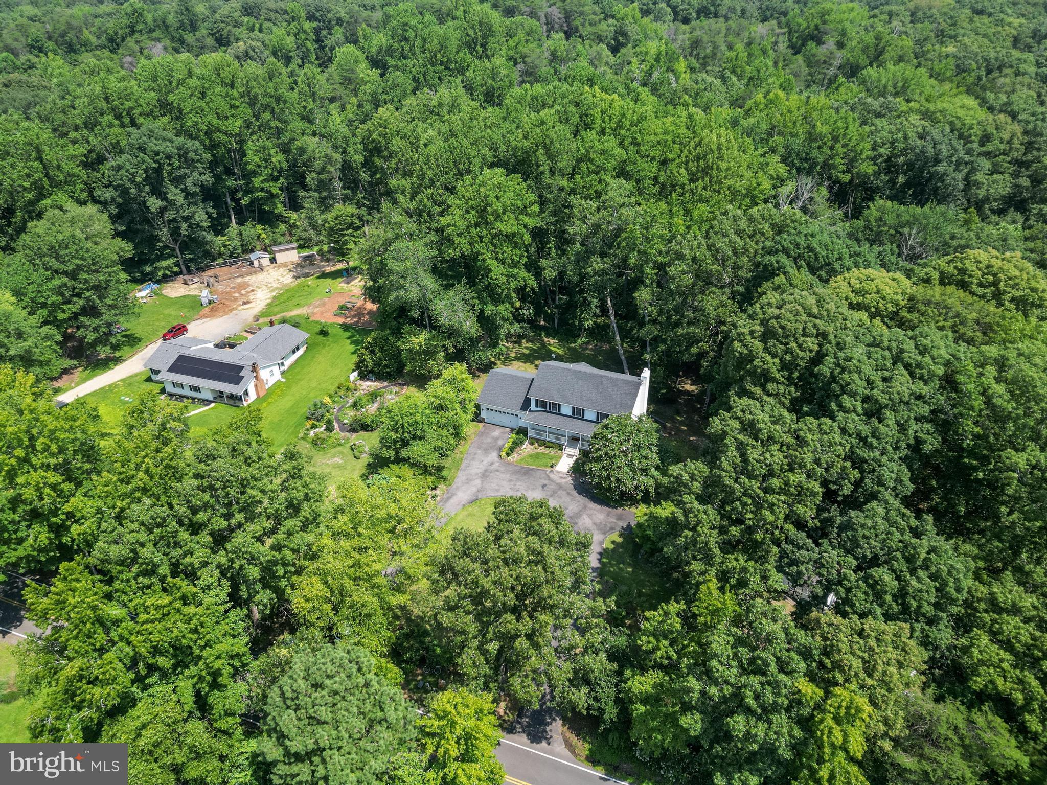 It's always a pleasure to take the back way home and enjoy the scenic drive as you approach this beautiful Colonial, nestled on nearly 8 acres of serene surroundings. Picture yourself relaxing on the front porch or the screened-in back porch, surrounded by the tranquility of nature. The property offers secure storage with two sheds and lovely grounds, that backyard was enhanced by Wentworths’ landscaping.
Inside, you'll find a formal living room, a formal dining room, and a spacious family room featuring a cozy stone gas fireplace. The breakfast area opens directly to the screened-in porch—perfect for enjoying crabs this summer and outdoor gatherings. The kitchen boasts stainless steel appliances and upgraded countertops, while the oversized laundry area provides ample storage space.
Upstairs, the owner’s suite offers a peaceful retreat, complemented by three sizable bedrooms. The basement features another large bedroom and a generous flex area—ideal for a home office, workshop, or creative space. The walkout basement leads to a patio, perfect for more outdoor entertaining.
Over the years, the owners have made numerous updates, including a new roof, upgraded gutters, some features of the bathrooms, fresh paint, upgraded flooring, and a replaced heat pump—just to name a few. Throughout the home, you'll notice thoughtful touches that make it truly special.
While it's tucked away off the beaten path, it's still convenient to all modern amenities, with easy access to routes into St. Mary’s, local parks, and military bases. This charming property offers the perfect blend of privacy and convenience.
