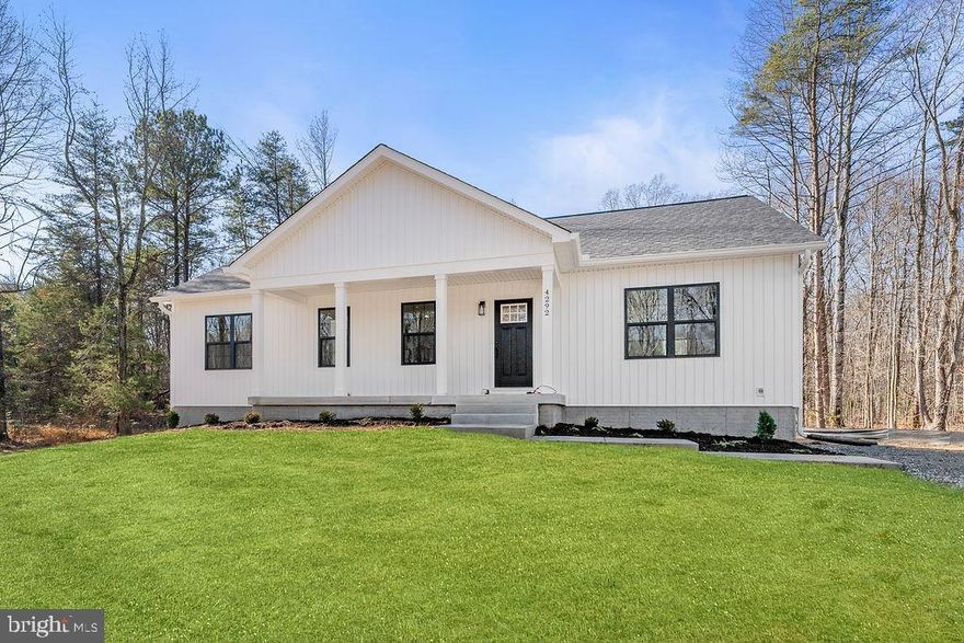 Completed New construction - The Boxwood from Ironwood Homes on 1.20 acres in Jerdone Island! Experience the magic of lake living in this beautifully maintained water-access retreat, located on the quiet, private side of Lake Anna. Home comes with a boat slip for lease.  Simple, yet elegant, this modern reinterpretation of country chic is the perfect home in which a young family can grow. The Boxwood’s open floor plan creates a bright and airy atmosphere. Each home is expertly fashioned with a luxury primary bathroom, farmhouse sink, exposed natural beams, and much more to give it a uniquely custom feel. Gorgeous 5 bedroom 3 full bath ranch home! Granite countertops and stainless steel appliances in the kitchen. There are tons of upgrades throughout the home- free-standing tub, hardwood floors, custom-look light fixtures, and gorgeous tiles! A completely finished basement provides another bedroom, a full bath, and a large recreation area! Community amenities include boat slips, a boat ramp, sandy beach, gazebo, and picnic area. Located just minutes from Elk Creek Country Store, dining, and groceries. Come see for yourself and fall in love with life at Lake Anna! You don't want to miss this opportunity!