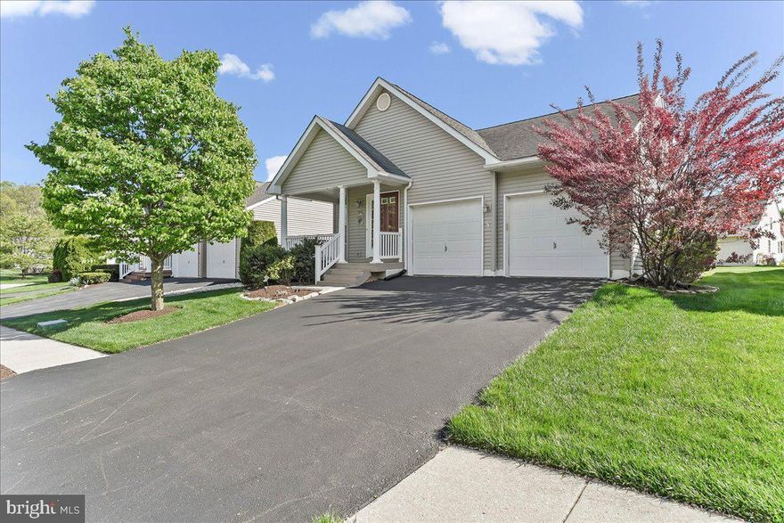 Homes in Villages at Penn Ridge don’t last long, and it’s easy to see why. This 55+ community offers a true sense of community along with easy, carefree living in a convenient location in southern Chester County.
As you enter this 2-bedroom, 2-bath home, you’re welcomed by a spacious living and dining room that creates a bright, inviting first impression. Hardwood floors run throughout most of the home, with the exception of the second bedroom. The kitchen features granite countertops and newer appliances, and opens seamlessly to the family room with doors leading out to the deck, making it ideal for both everyday living and entertaining. The partially finished basement adds valuable extra living space along with plenty of storage. Additional highlights include a two-car garage and a welcoming front porch. The HVAC system was replaced in 2018 by the previous owner and the hot water heater within the past five years. Ideally located near shopping, the YMCA, and Route 1 in Jennersville.