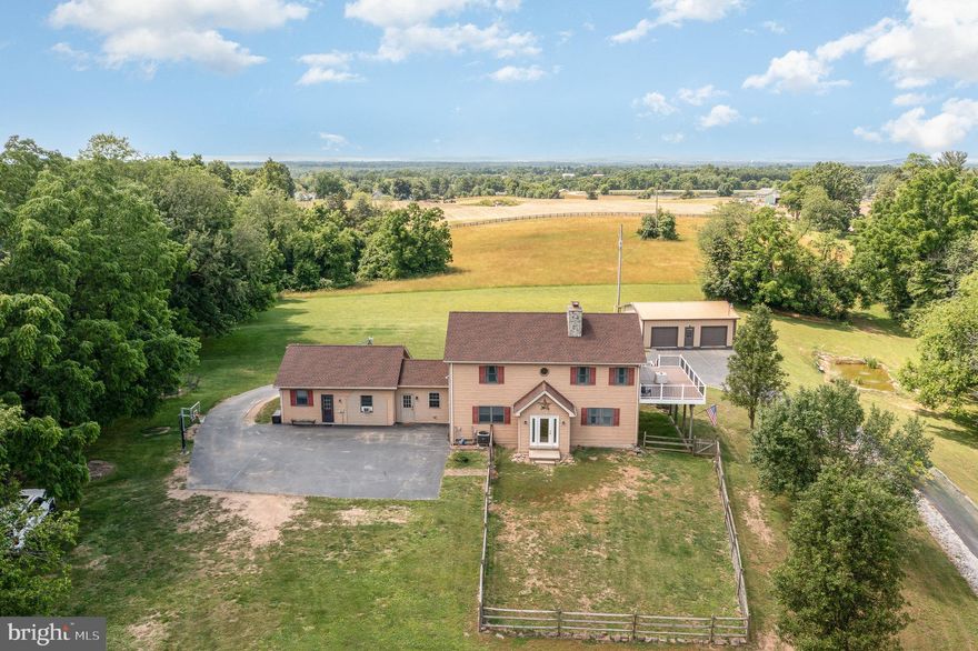 Back on the Market!  We're excited to announce that this stunning home is back on the market!  The previous buyer couldn't secure a contract on their own property, which means this incredible opportunity is available again!  Hilltop paradise on nearly 5 acres of total privacy and seclusion.  Properties like this rarely become available. This  lovingly cared for home  features 7 bedrooms and 4 1/2 baths.  This home also allows for multigenerational living with separate guest quarters and a first floor primary bedroom.  Some of the amenities include 2 fireplaces, a 32 x24 Morton Pole building and an upper level great room with newer decking to enjoy the beautiful sunsets.  Finished basement with large bedroom and full bath, lighted basketball court, above ground pool, newer hot tub and recent addition of mini-splits are just a few of the many perks to owning your forever home.  Newer well pump and new pool pump.