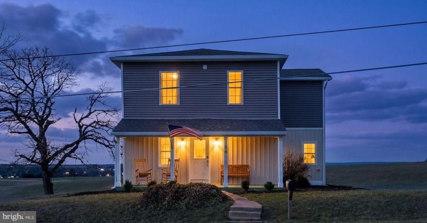 Welcome to this beautifully rebuilt modern farmhouse in New Windsor, where timeless charm meets modern comfort on 1.53 scenic acres. Originally dating back to the 1870s and thoughtfully rebuilt in 2023, this three bedroom, two full and one half bath home offers over 2,050 square feet of light filled living space surrounded by peaceful farmland views.  Use your built in firepit on the patio to watch the amazing sunsets over the farmland!

The open first floor creates an inviting flow between the living room, dining area, and kitchen, perfect for everyday living and entertaining. Enjoy quiet mornings on the welcoming front porch while taking in the surrounding countryside. Upstairs you will find three spacious bedrooms including a private primary suite with walk in closet featuring custom shelving and a beautifully appointed bath with dual vanity and separate shower. A convenient laundry room located on the bedroom level adds everyday functionality.

Major systems have been recently updated including a new hot water heater installed in 2026, offering added peace of mind for the next owner. Located just ten minutes from downtown Westminster shopping and dining, fifteen minutes to Old Westminster Winery, and minutes from scenic walking trails, this property offers the perfect balance of rural tranquility and convenient access to town amenities.