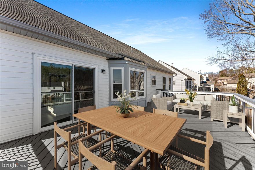 Welcome to this beautifully remodeled home, offering over 2,600 square feet of thoughtfully updated living space and breathtaking views from the expansive double-level rear deck. Featuring 4 bedrooms, 3 full bathrooms, and a spacious 2-car garage with additional storage, this home creates the perfect environment for both everyday living and unforgettable moments.

As you step inside, you'll immediately appreciate the open floor plan, where the living room, dining area, and kitchen flow together effortlessly. The spacious living room features an electric fireplace and a stunning bay window, offering a cozy spot to relax or take in the view. The fully remodeled kitchen (2021) showcases bright white cabinetry, modern finishes, and a spacious layout, ideal for cooking and entertaining.

The primary bedroom offers soft grey carpeting and a beautifully remodeled ensuite bathroom, complete with a frameless shower, elegant tile work, and an upgraded vanity. The additional bedrooms are generously sized and offer ample closet space, while the updated secondary bathroom adds an extra touch of modern luxury.

Downstairs, you’ll find a spacious rec room, ideal for movie nights, unwinding, or casual gatherings. The room is pre-wired for surround sound and includes a gas line hookup for a portable fireplace. Completing the lower level is a large bedroom, an updated bathroom featuring a stunning walk-in shower, a laundry area, and convenient access to the two-car garage.

Step outside to discover the expansive double-level deck, a fully fenced backyard, and a pebble stone area perfect for a fire pit to roast marshmallows. Whether you're savoring a quiet morning coffee or hosting a gathering with friends, the outdoor space is ideal for creating lasting memories. 

Major system updates provide peace of mind, including roof replacement (2019), updated windows (2015), a Carrier A/C system (2018), a new water heater (2021), replaced carpet (2020), and modern light fixtures (2021).

Conveniently located near shopping, dining, major commuter routes, and the VRE, this home is more than just a place to live—it’s a place to truly call home. Ready to move in and make it your own, this home is perfect for both everyday moments and life's biggest celebrations.