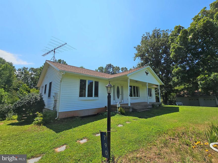 Immaculate home  boasting one-level living with 3 bedrooms, 3 full baths and a 1,500 square foot finished basement offering tons of extra living space! Situated on over 6 private acres, you'll love the peace & quiet as soon as you pull up to this property with its park-like setting & beautiful country views! Outside has so much to offer with a sprawling, level front yard, front porch & rear deck to take in the tranquil surroundings, and an oversized detached garage perfect for so many uses. Inside, you'll be greeted by light-filled rooms with large windows throughout, handsome hardwood floors, huge sun-room on the back with vaulted ceiling & tall windows all around, open kitchen/dining arrangement, and main level laundry room. The lower level has been finished to include a massive family/rec room with a corner gas fireplace, cedar closet, full bath, a bonus room that could be used for an additional bedroom, as well as a large utility room. Don't forget to step outside the walkout lower level & see the rear patio for even more outdoor enjoyment surrounded by wooded privacy. Come see & let your creativity take over to make this amazing home your own!!