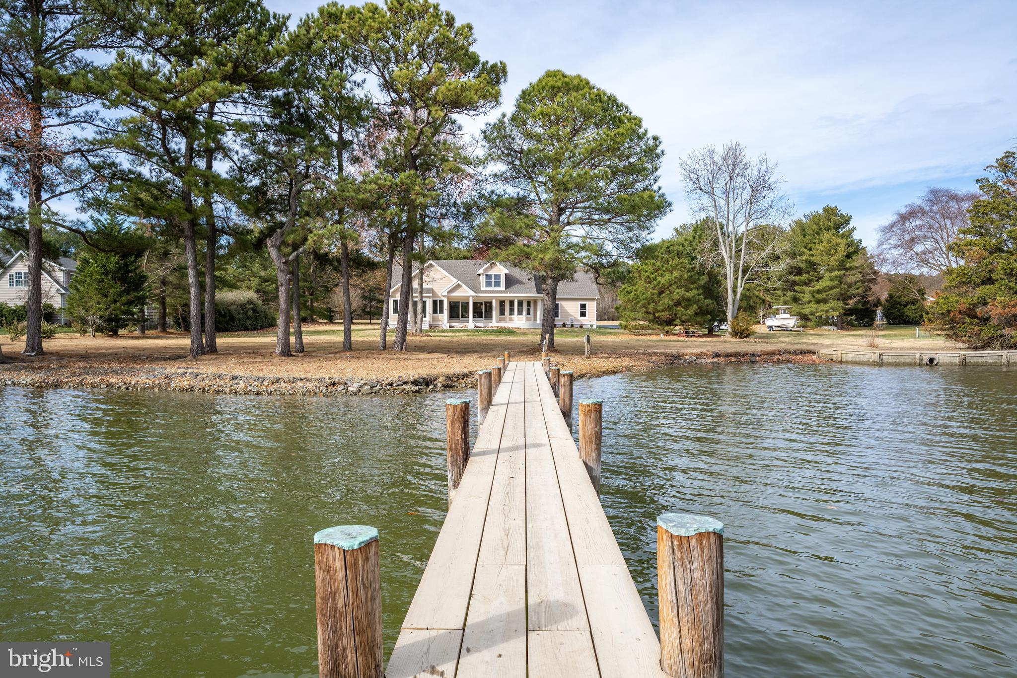 SELLER SAYS BRING ALL OFFERS!!!
Step into waterfront luxury with the spectacularly reimagined 4 bedroom, 3 bath custom home on Harris Creek meticulously remodeled by RBCI, Inc., an award-winning custom home builder.
No expense was spared in creating this 2,731 sq. ft. masterpiece on over 1.5 acres of magnificent waterfront living. New flooring, counter tops, appliances, garage floor, extended ceiling and walls in master, new vanities, tile, showers, tubs, lighting, carpet, paint, vinyl siding, roof, exterior lighting, driveway and more. Front and rear of house have been reconfigured. New doors, windows and sliders. HVAC is 8 years old.
Enjoy your own private deeded dock, complete with a 15,000 lb. boatlift and 5' MLW- perfect for the water enthusiasts.
A sophisticated design includes hardwood floors and a gas fireplace providing a warm and inviting atmosphere throughout.
Entertain with ease in the chef inspired kitchen featuring quartz countertops, custom cabinetry, sub zero refrigerator and stainless-steel appliances including a built-in microwave, dishwasher and Blue Star 8 burner range with double door ovens.
The first-floor primary suite includes an en-suite bath featuring both soaking tub and shower as well as double vanity, granite vanity top and custom cabinetry. A large walk-in closet also features custom shelving. Second floor finds two extra-large bedrooms and one bath. Utilize one as a bedroom and the other is large enough to be a workout or playroom. Both overlook the water.
A permit is in process for the new owner to construct a swimming pool, offering an opportunity to create your own dream backyard oasis.
The home includes a two car garage and a large newly sealed driveway to house a multitude of vehicles.
All furniture and decor are intended for staging but can be purchased separately.
Mallard Point roads are scheduled to be widened in 2025. Owner has paid this assessment.
This is your chance to own a luxurious retreat in a prime secluded location close to St. Michaels.
Schedule your private showing today!